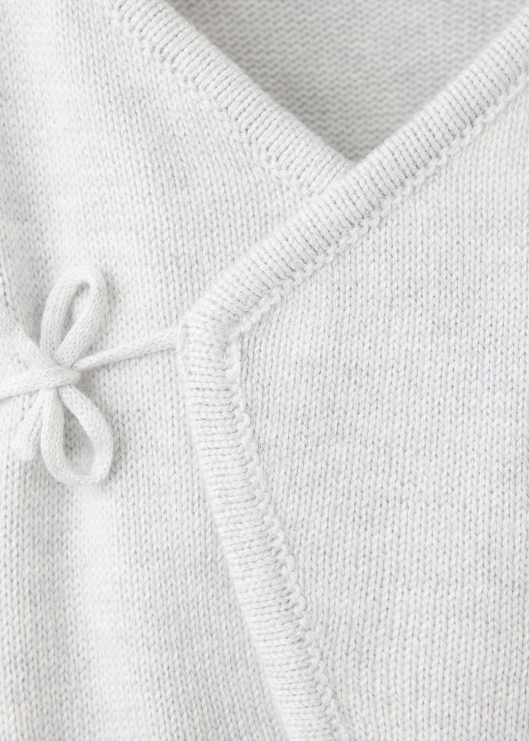 Mono largo cruzado - Detalle del artículo 8, Gris claro vigoré. Ref: 37074448-00.