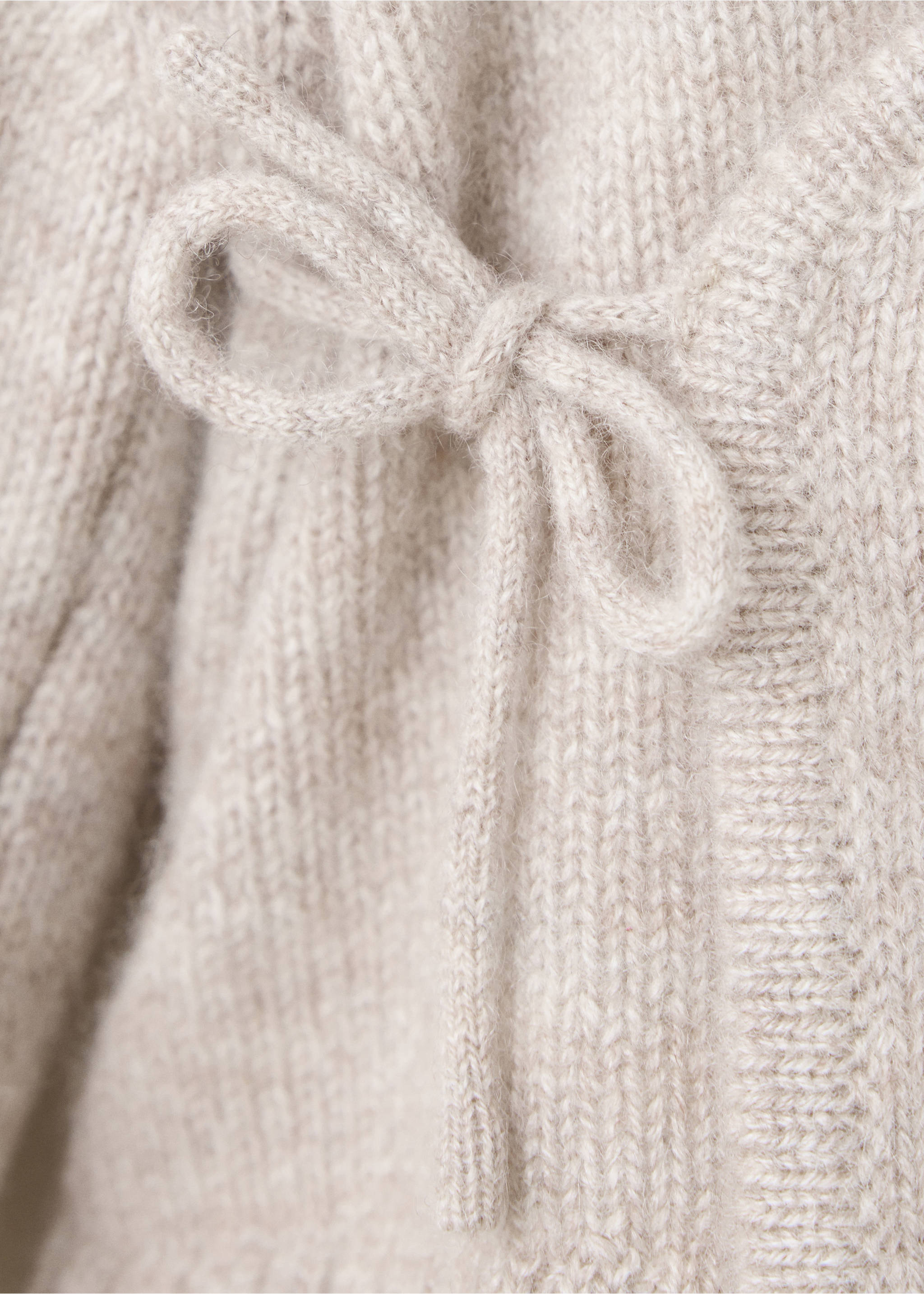 Beige knit jersey detail showing a side tie bow, Sand. Ref: 37074467-00.
