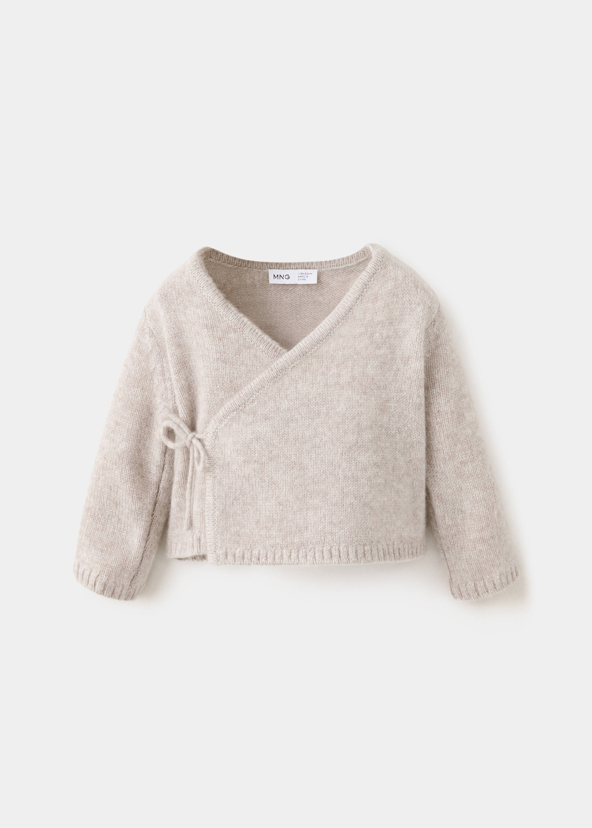 Beige marled knit wrap cardigan with a V-neckline and side tie.