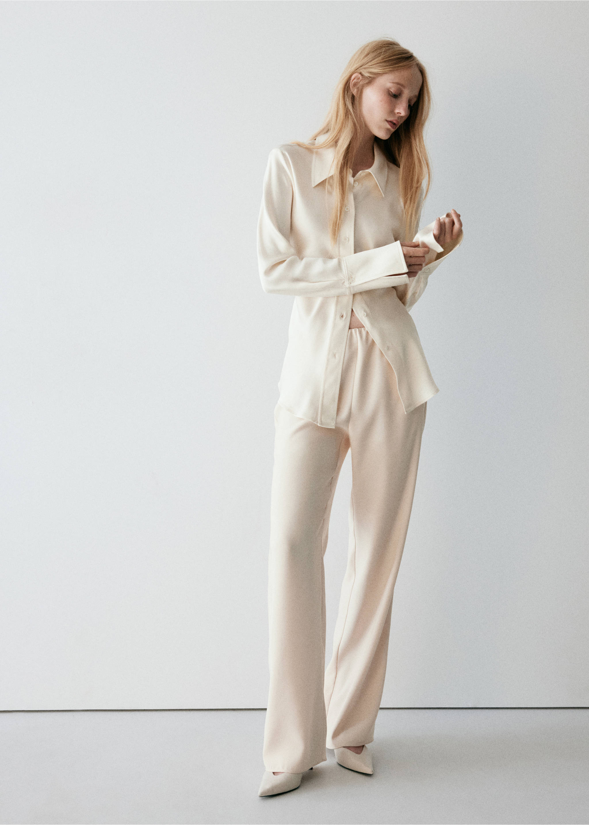 Ecru trousers with a relaxed straight-leg fit, worn with a matching shirt., Ecru. Ref: 37074471-01.