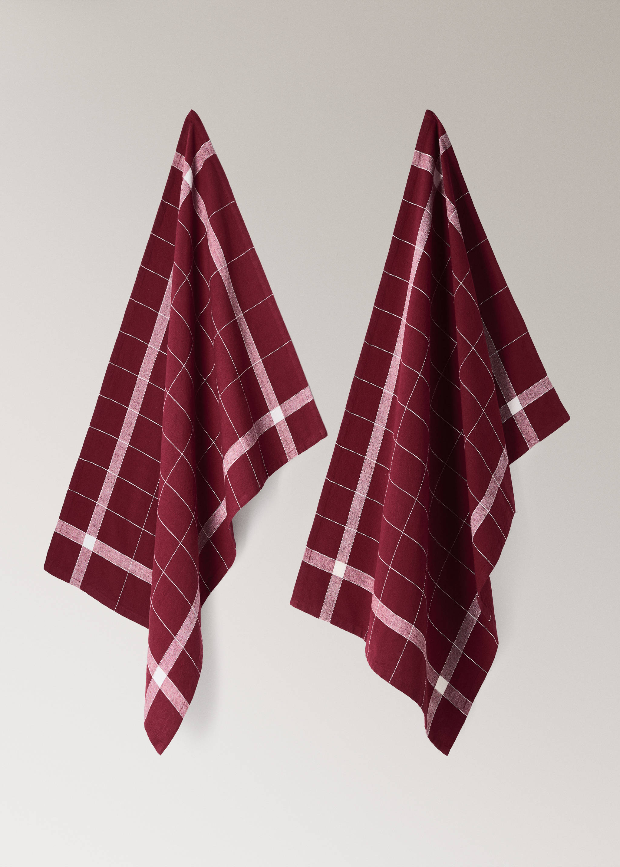 Two maroon kitchen towels with a white grid check pattern.