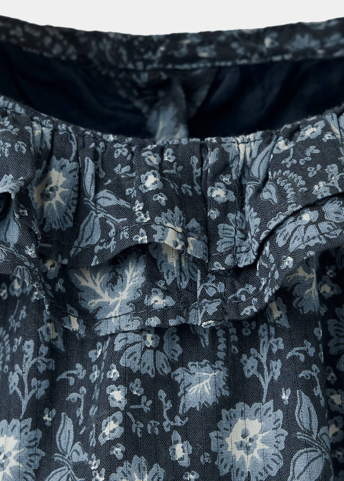 Long-sleeved floral romper — Petrol Blue
