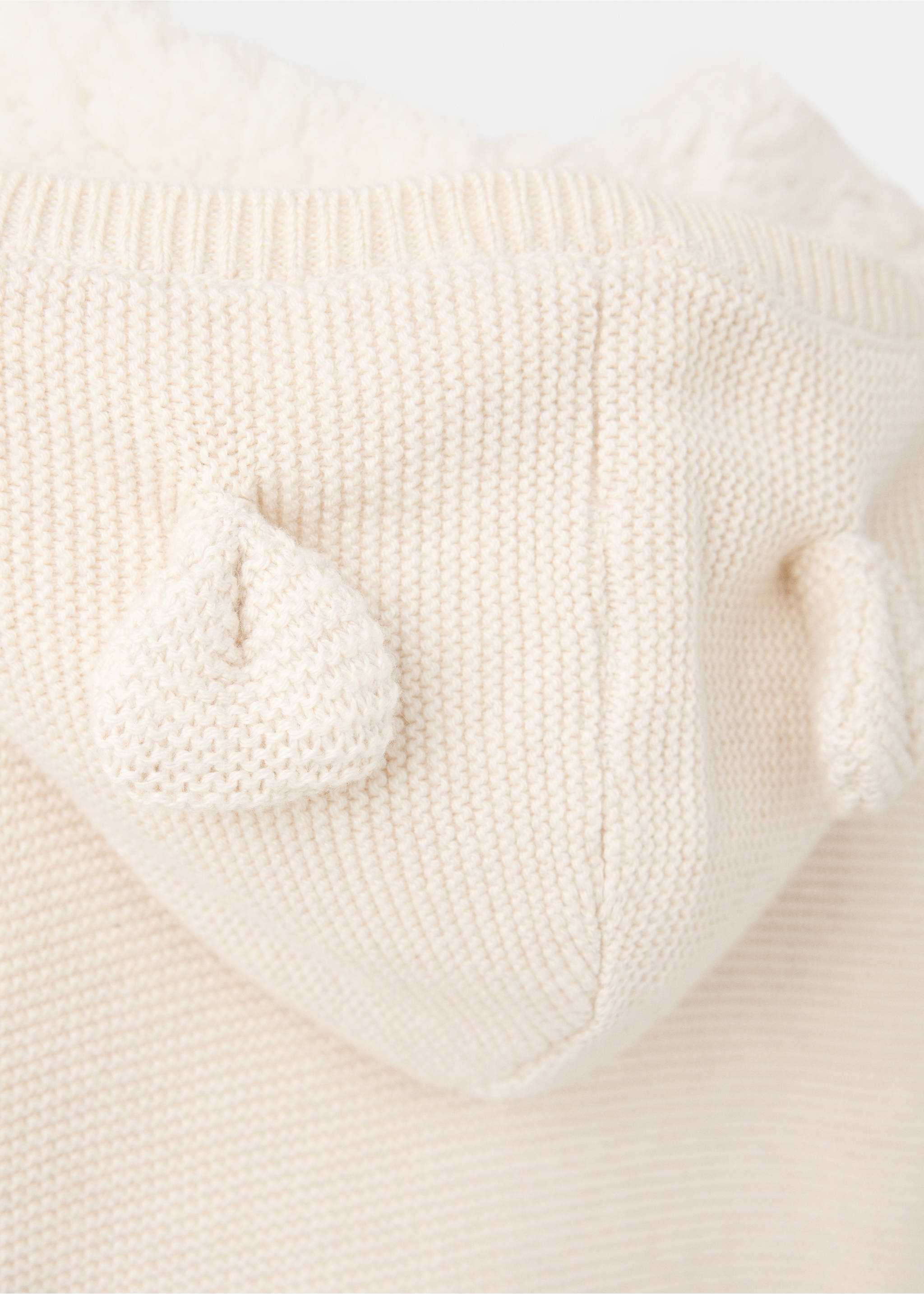 Cream knit cardigan fabric detail showing the textured hood with decorative ears., Sand. Ref: 37076354-00.