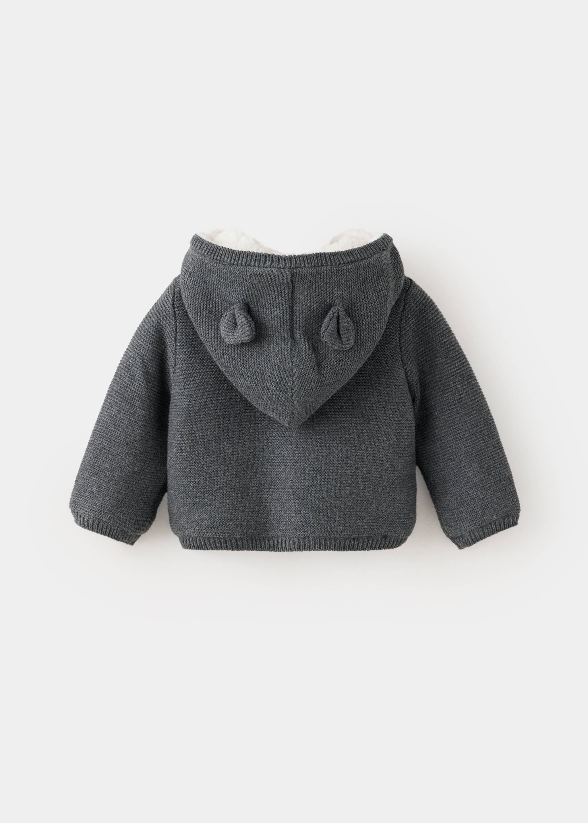 Dark grey knitted children's cardigan with a bear-eared hood, back view.
