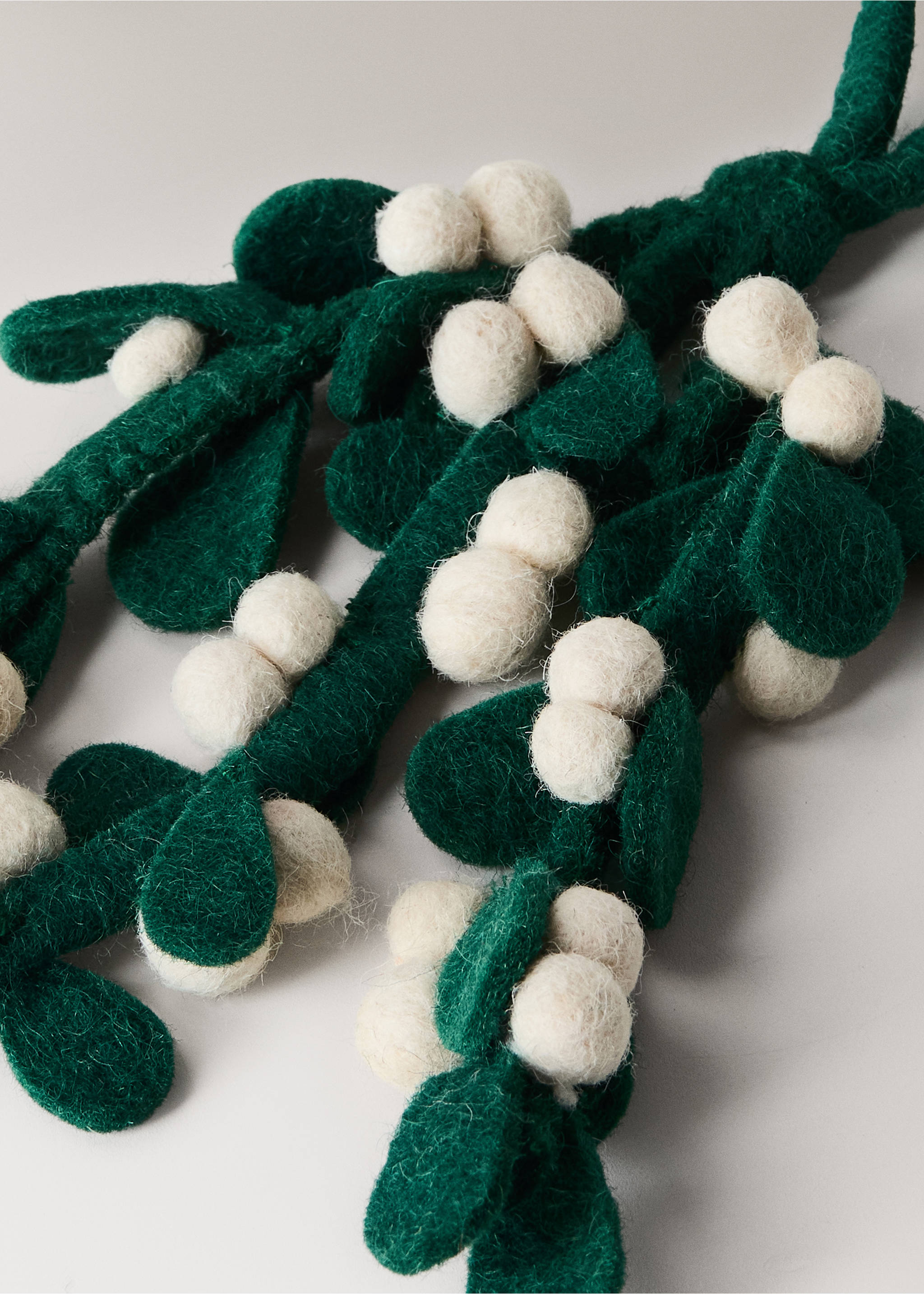 Dark green felt mistletoe branch with off-white felt berry clusters., Green. Ref: 37076728-00.