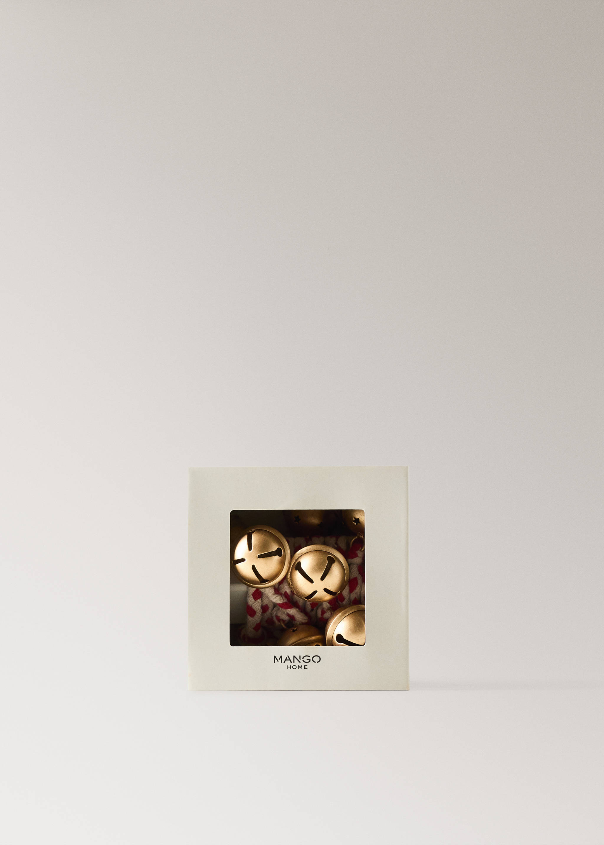 Garland with gold jingle bells in a square box.