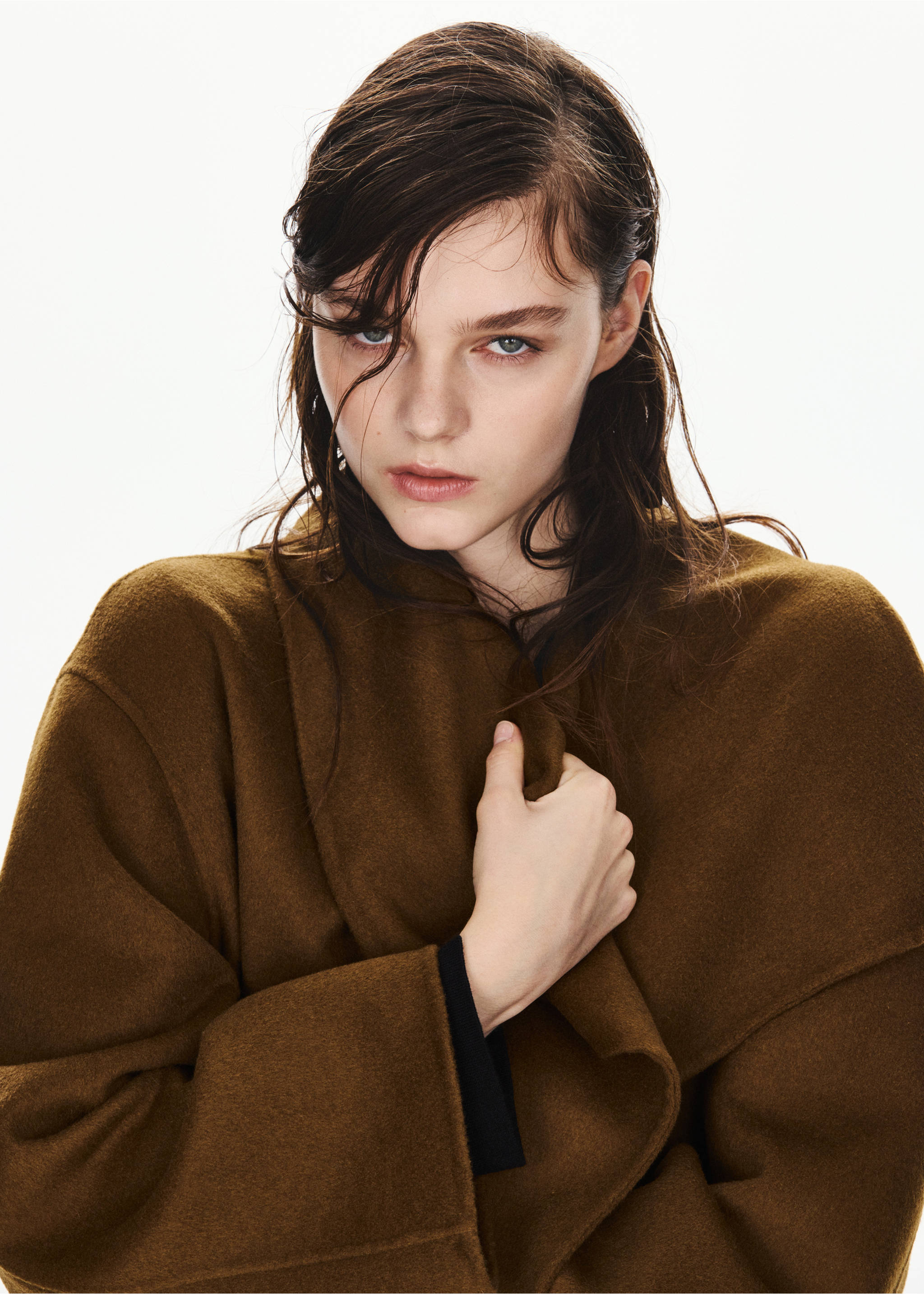 Brown jacket with a soft textured fabric and draped open neckline in a close-up portrait., Medium Brown. Ref: 37076739-00.