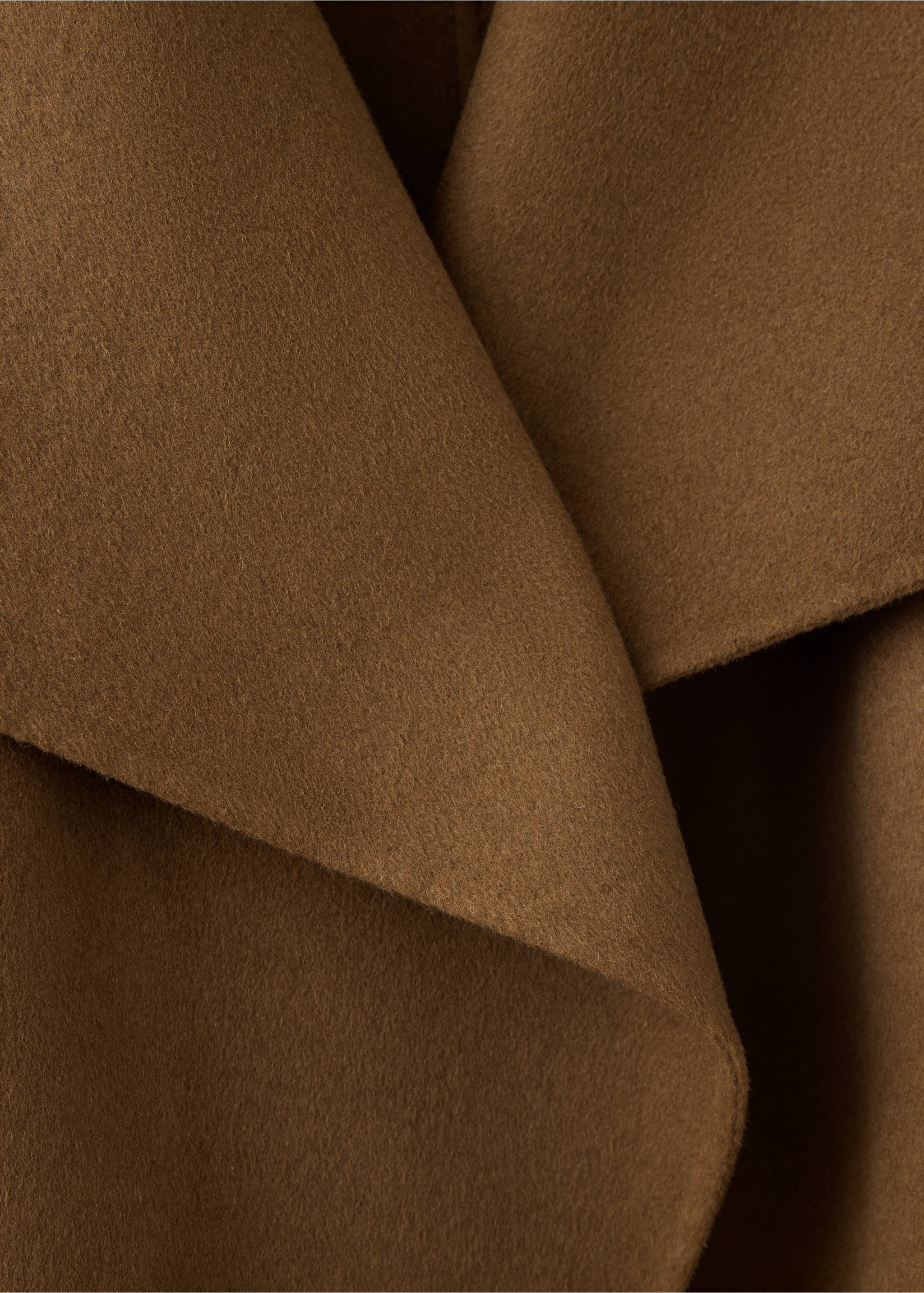 Close-up of the soft brown fabric texture and draped lapel on a jacket., Medium Brown. Ref: 37076739-00.