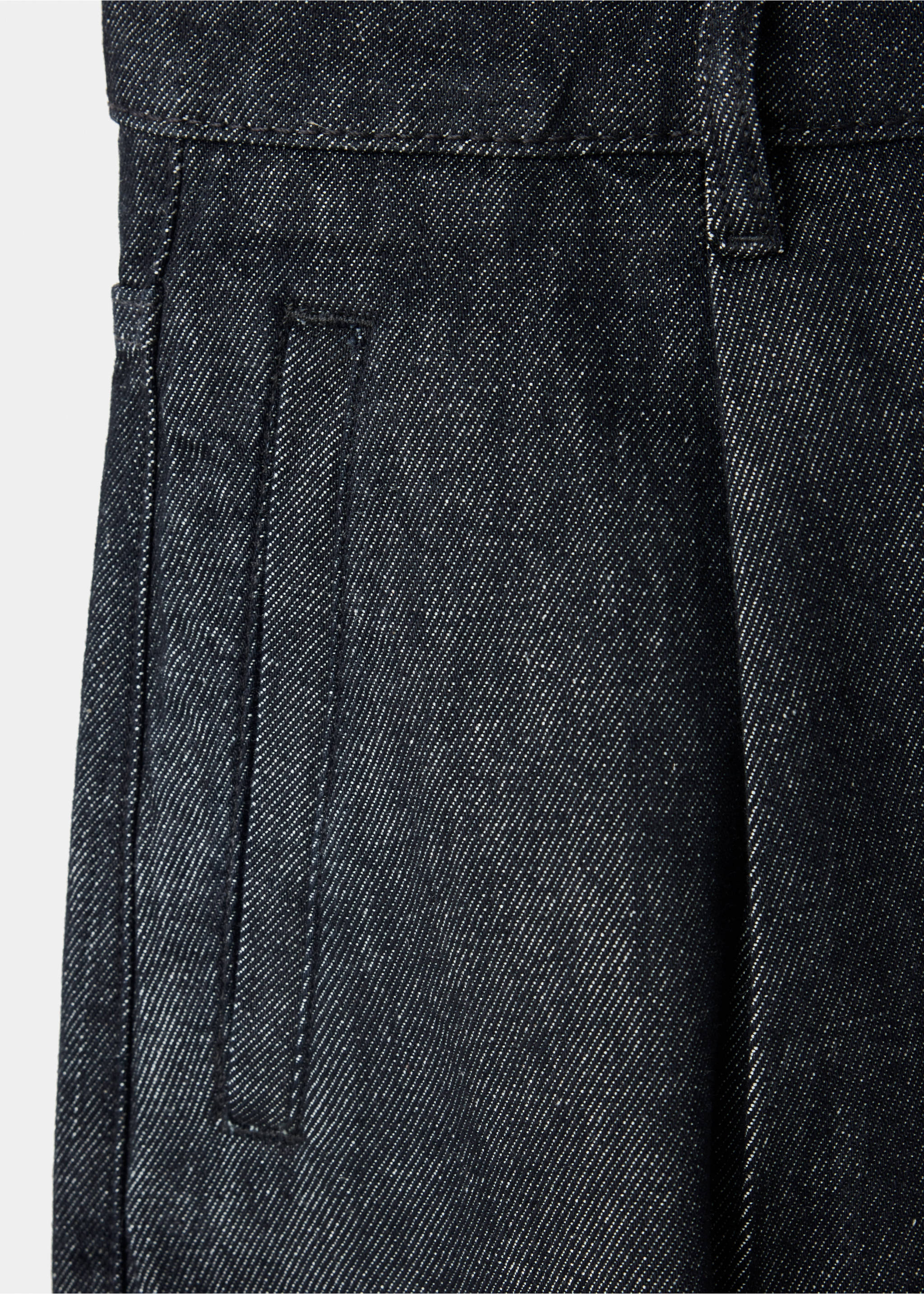 Close-up of dark denim trousers showing pocket and waistband detail., Black. Ref: 37076748-00.