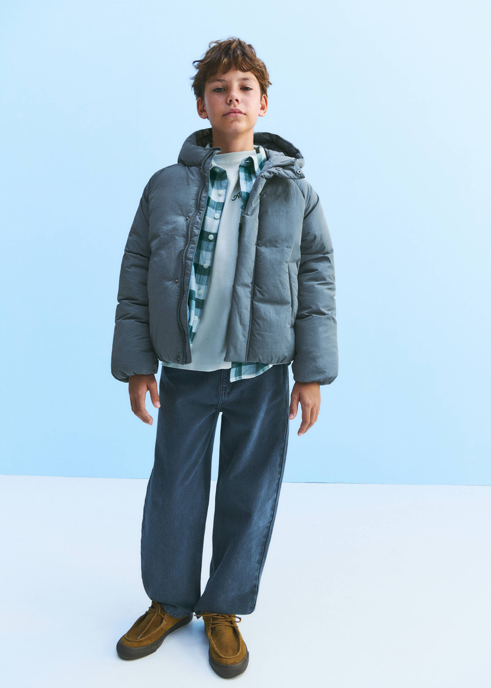 Grey padded anorak with hood worn over an open checkered shirt and trousers., Forest Green. Ref: 37077130-00.