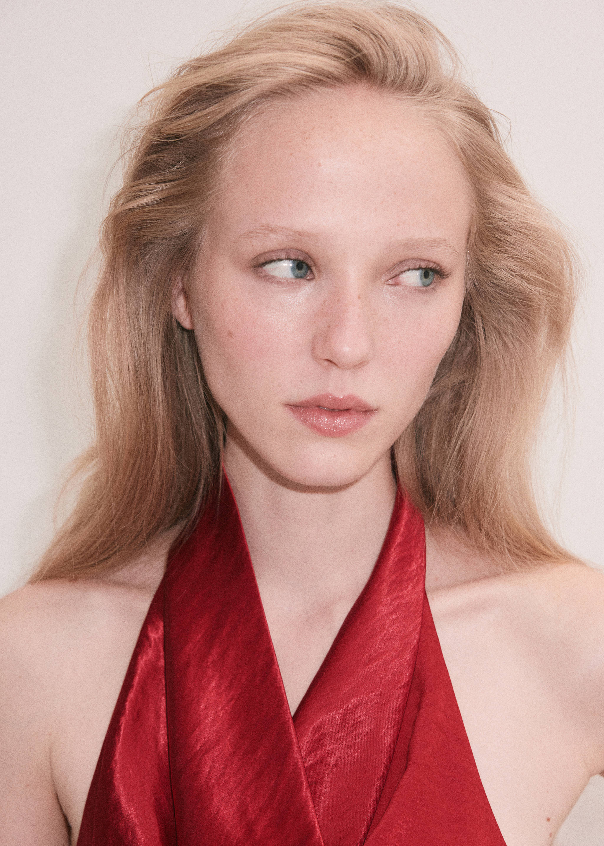 Red satin halterneck top with a structured overlapping V-neck collar.