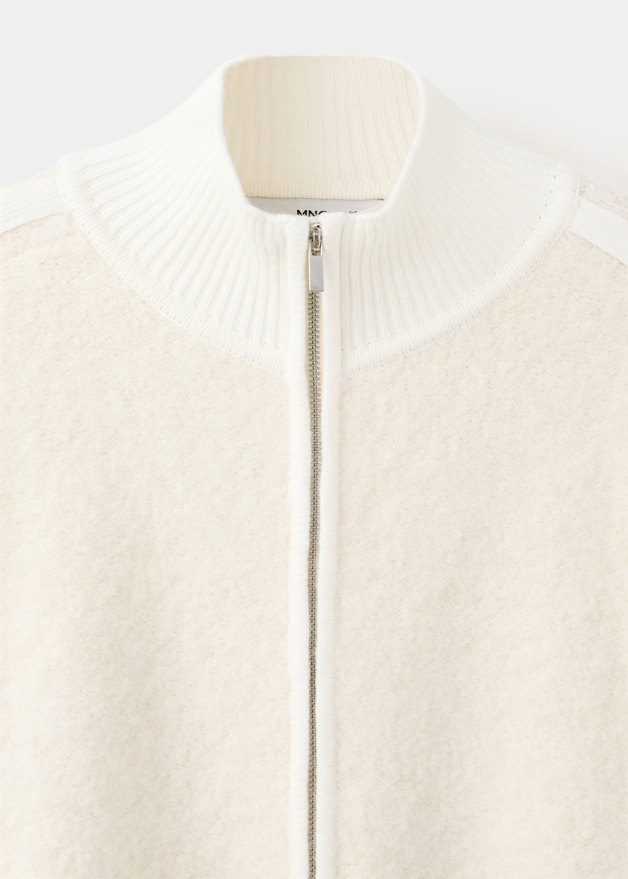 Cream jacket collar and zip detail