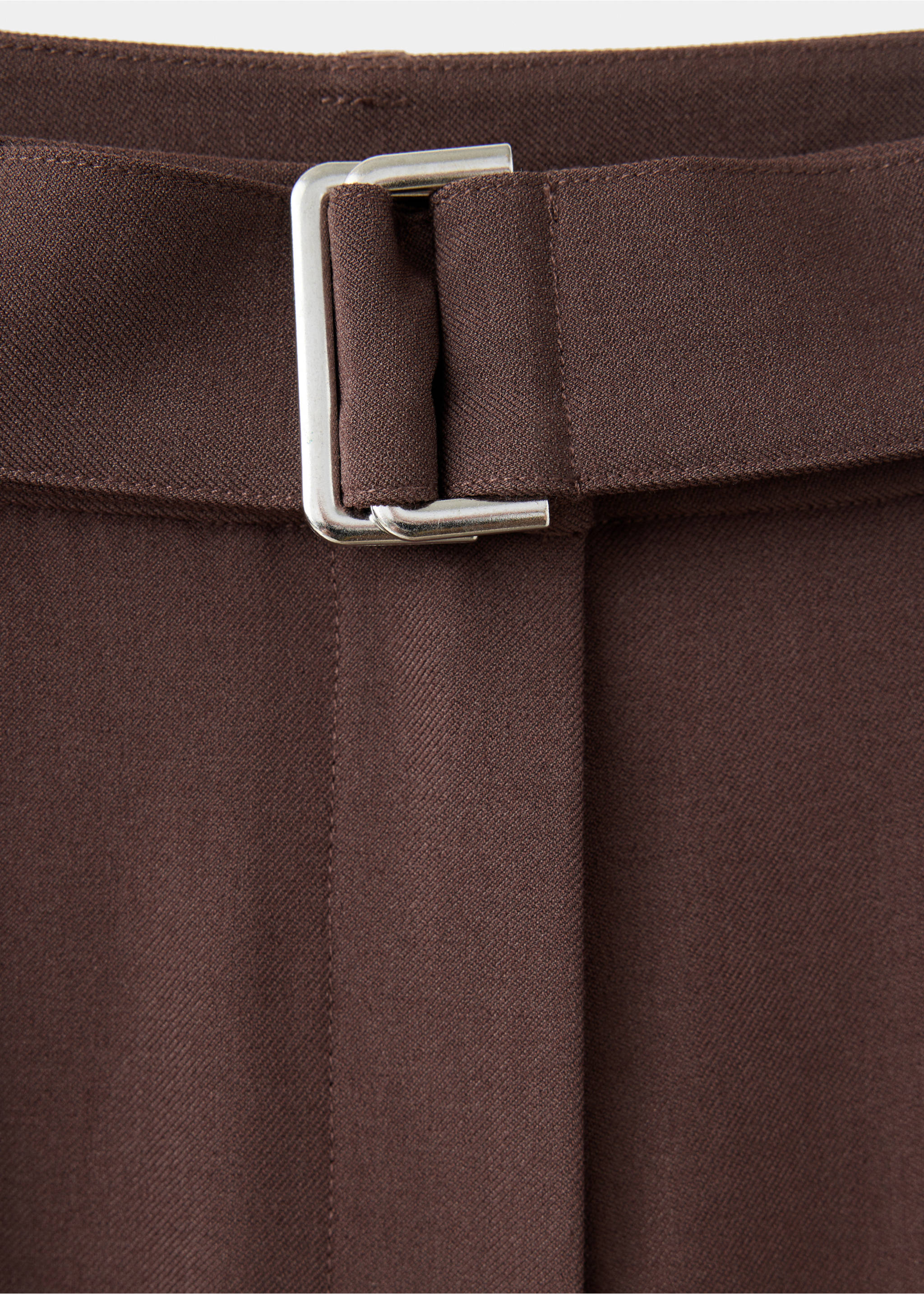 Close-up of brown trousers featuring a matching belt with a silver-tone metal double-ring buckle., Brown. Ref: 37077790-00.