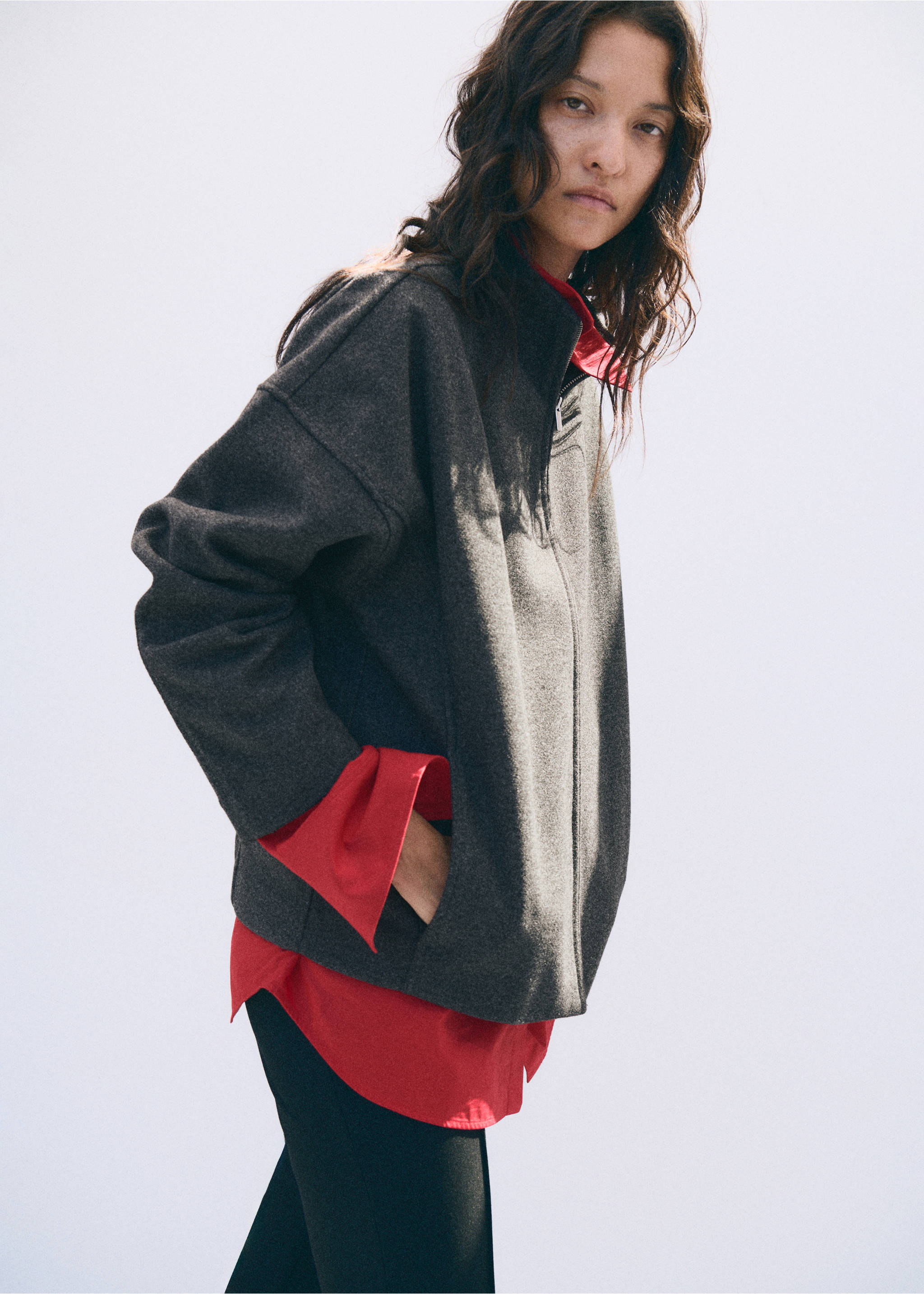 Dark grey zipped jacket with a high collar, worn over a red shirt., Grey. Ref: 37077791-00.