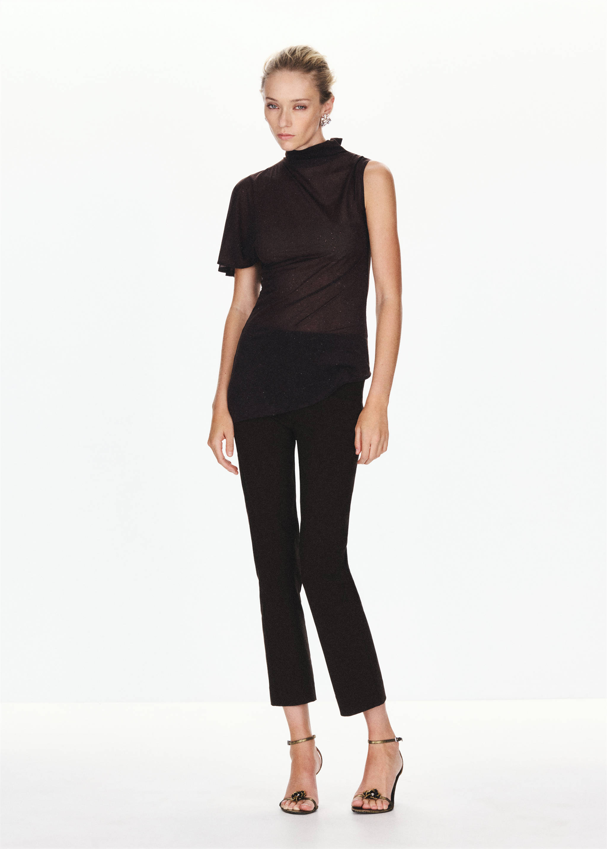 Dark shimmering asymmetrical top with high neck and draped sleeve.