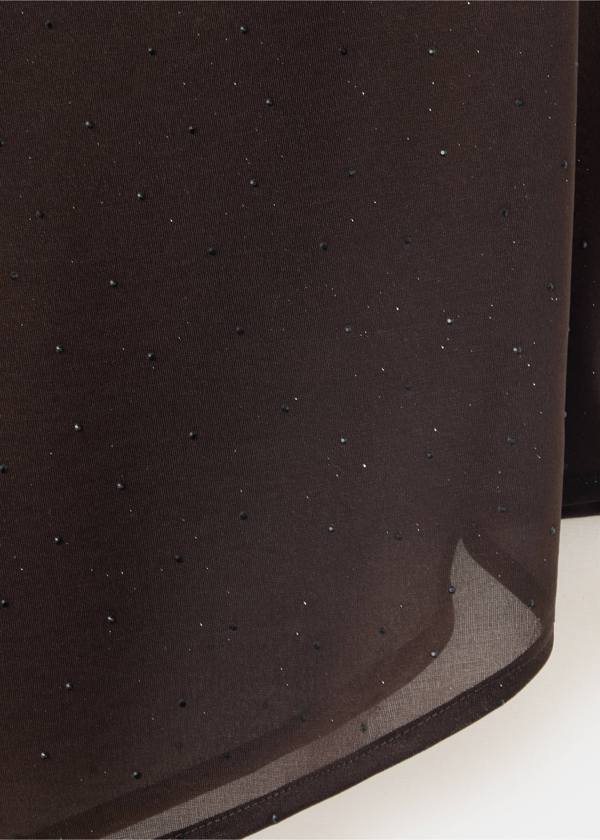 Close-up fabric detail of a dark brown sheer top with scattered beads., Chocolate. Ref: 37077793-00.