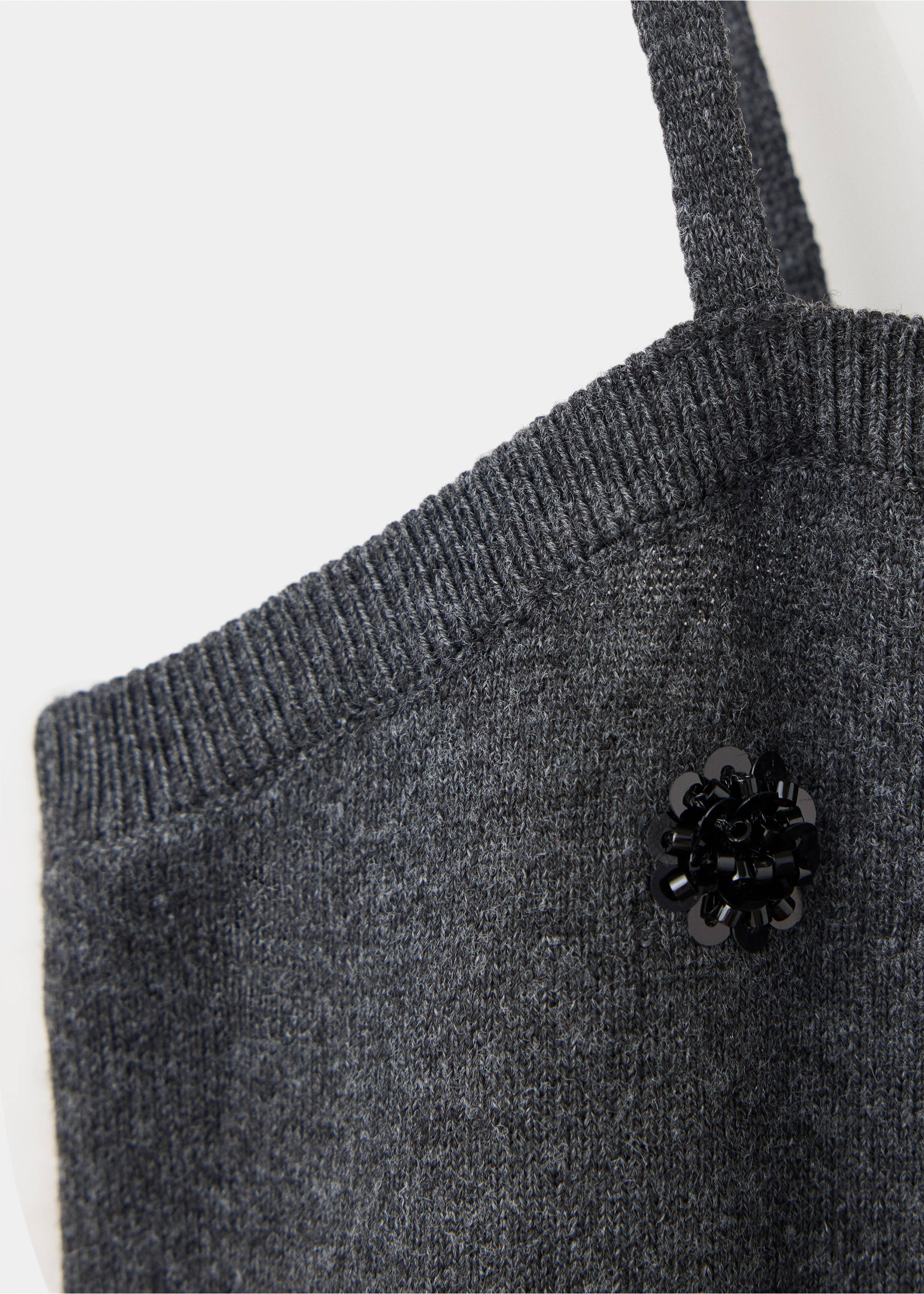 Dark grey knitted top detail with a beaded flower appliqué., Charcoal. Ref: 37077796-00.