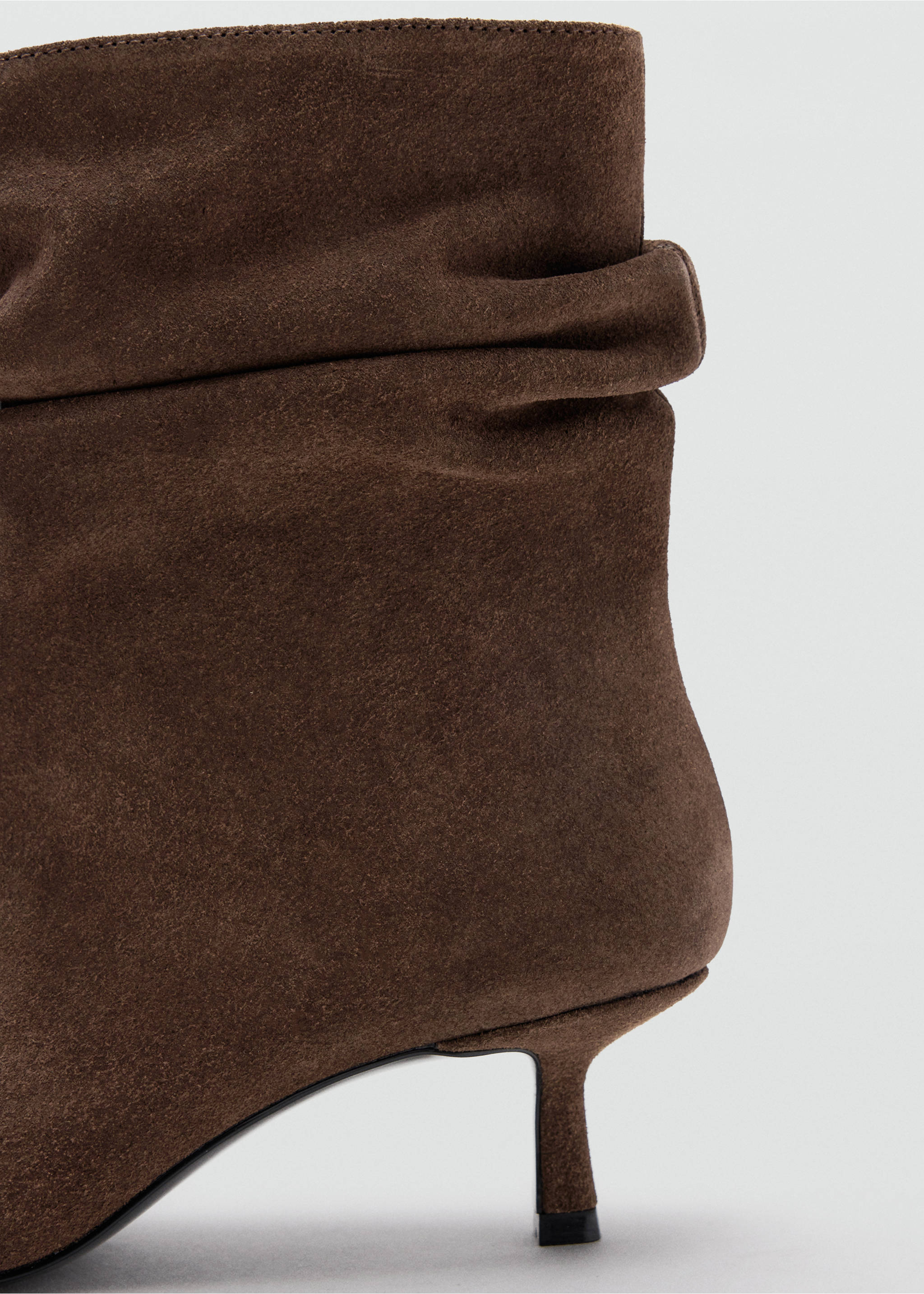 Brown suede ankle boot with a slouchy shaft and kitten heel in close-up., Chocolate. Ref: 37077797-00.