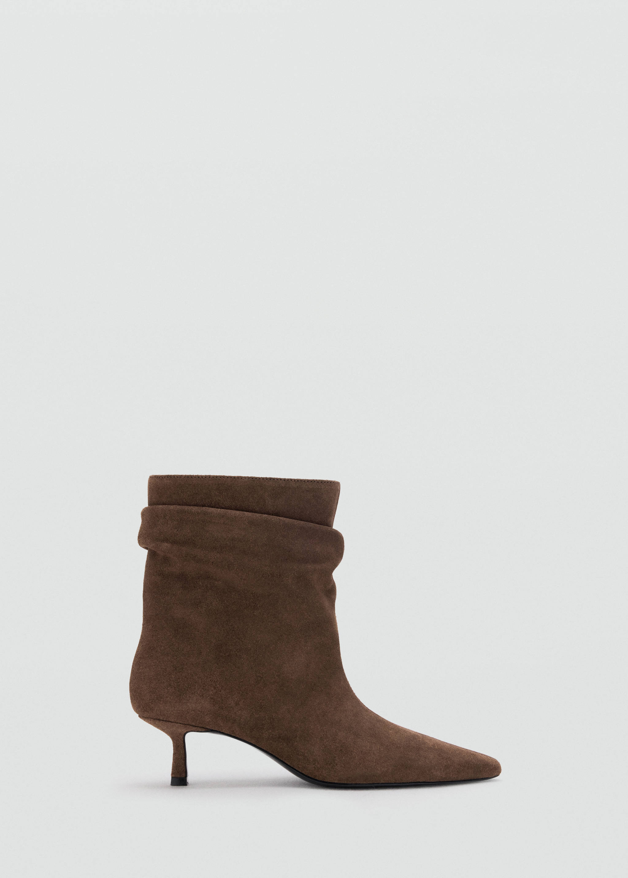 Brown slouched ankle boot with a pointed toe and kitten heel.