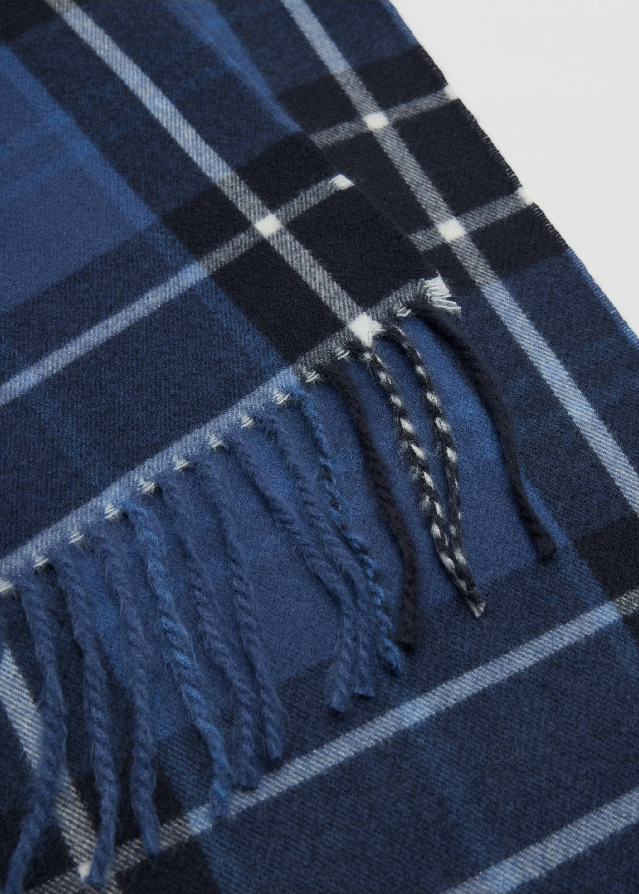 Close-up of a blue plaid scarf with fringe detail., Navy. Ref: 37077801-00.