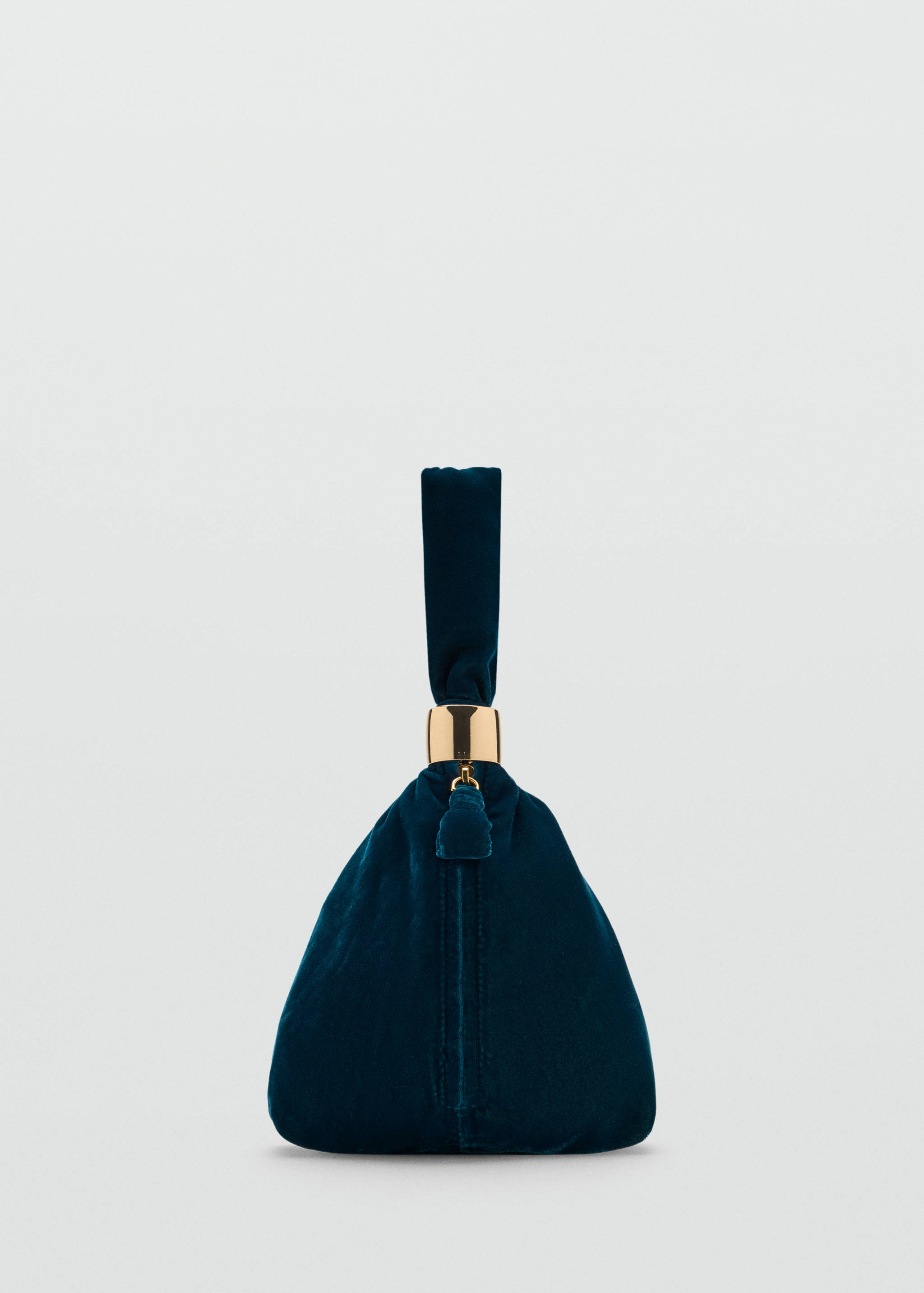 Dark teal velvet handbag with a gold-tone metal ring and a single handle.