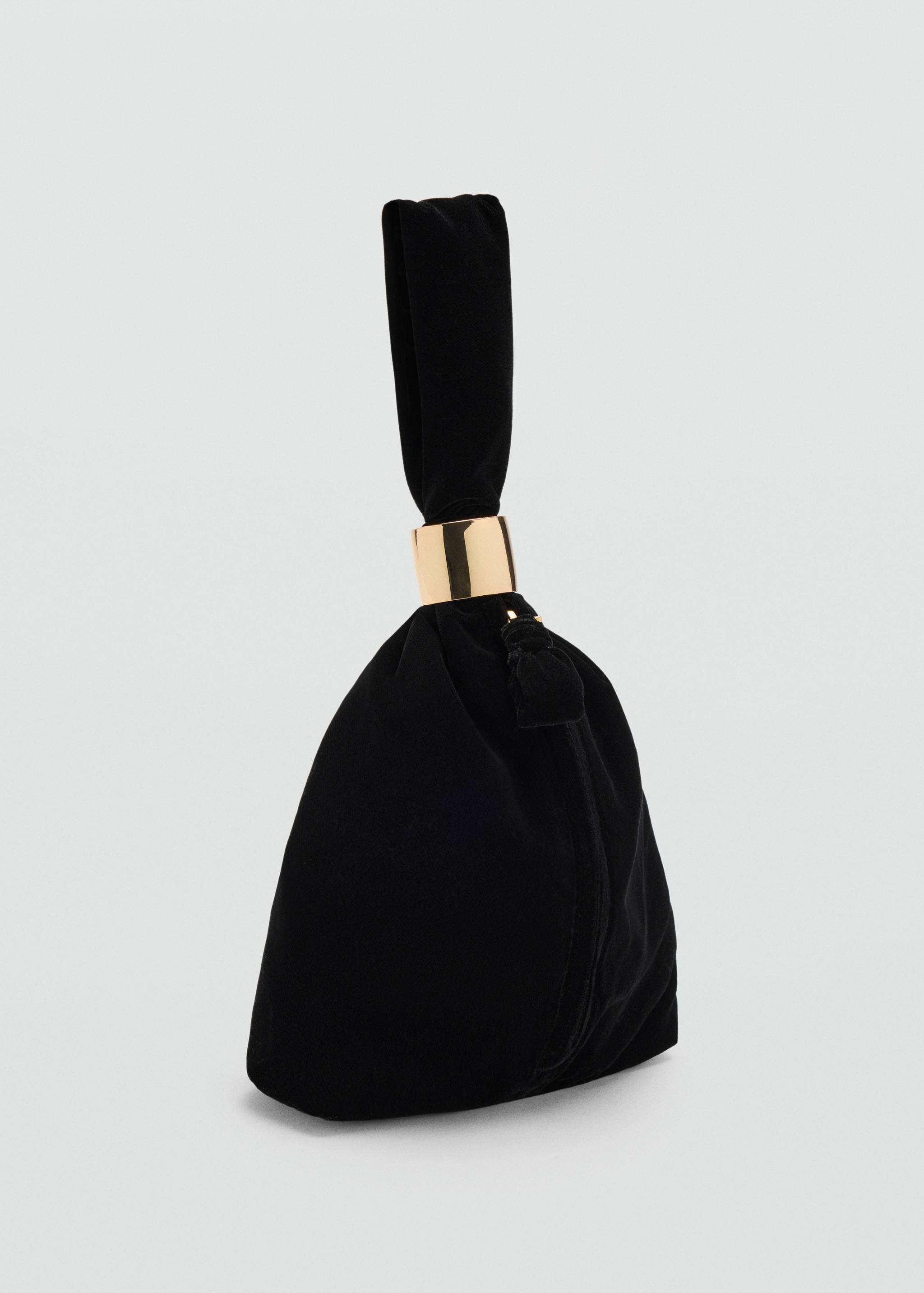 Black velvet handbag with a soft gathered pouch shape and gold-coloured metal ring detail.