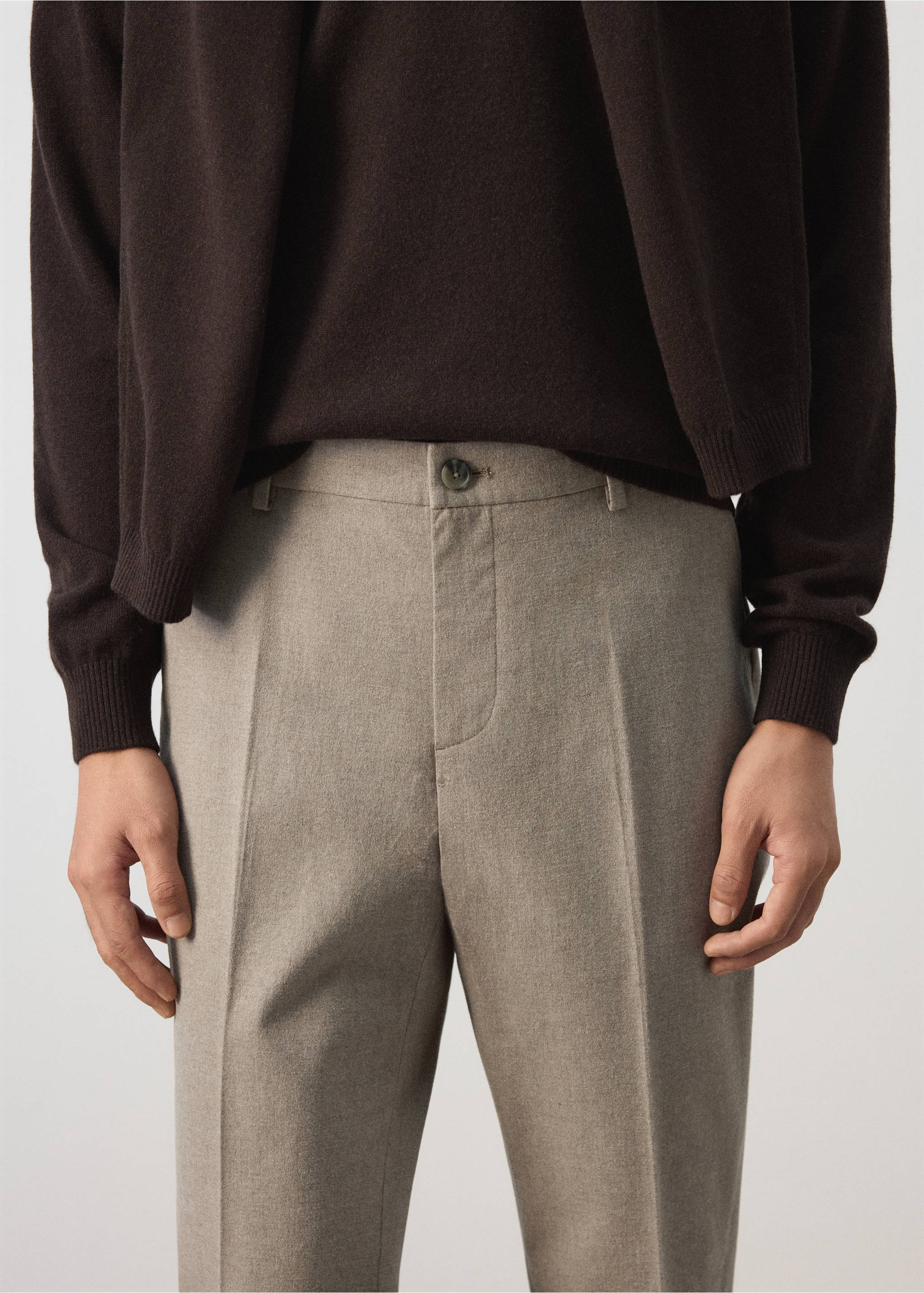 Close-up of light grey trousers with a centre crease and belt loops., Beige. Ref: 37077882-00.