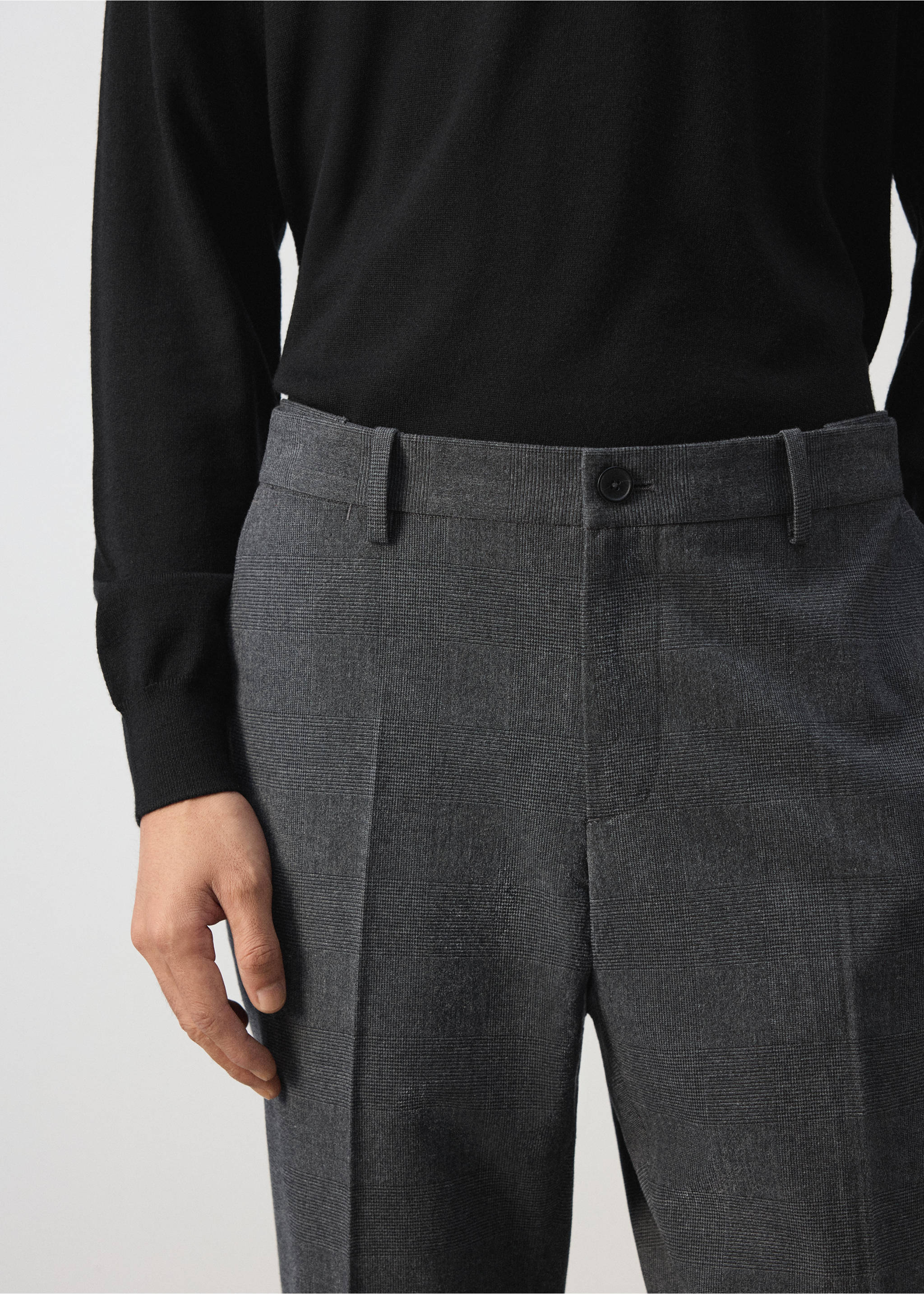 Close-up of grey patterned trousers with belt loops and button fastening., Dark Heather Grey. Ref: 37077883-00.