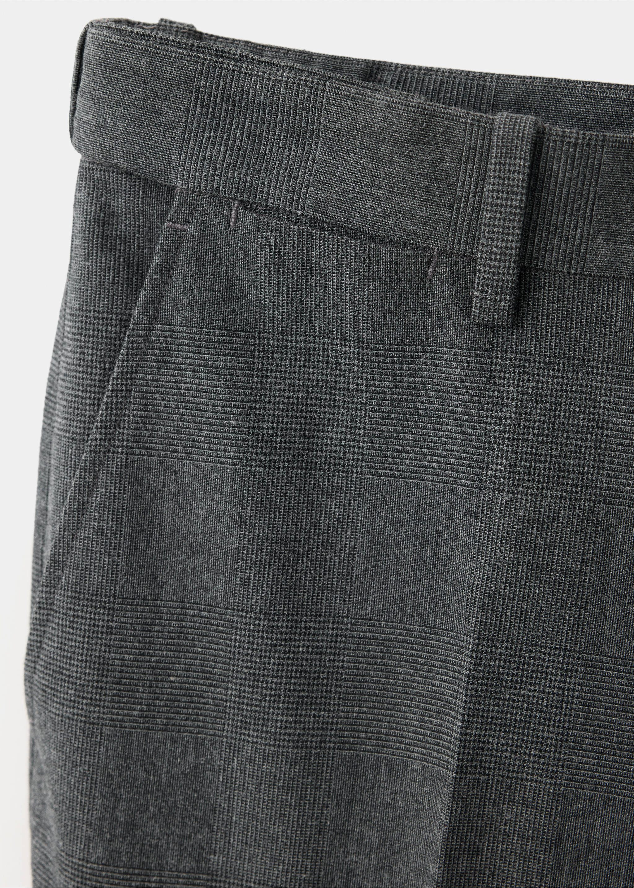 Close-up fabric detail of dark grey checked trousers., Dark Heather Grey. Ref: 37077883-00.