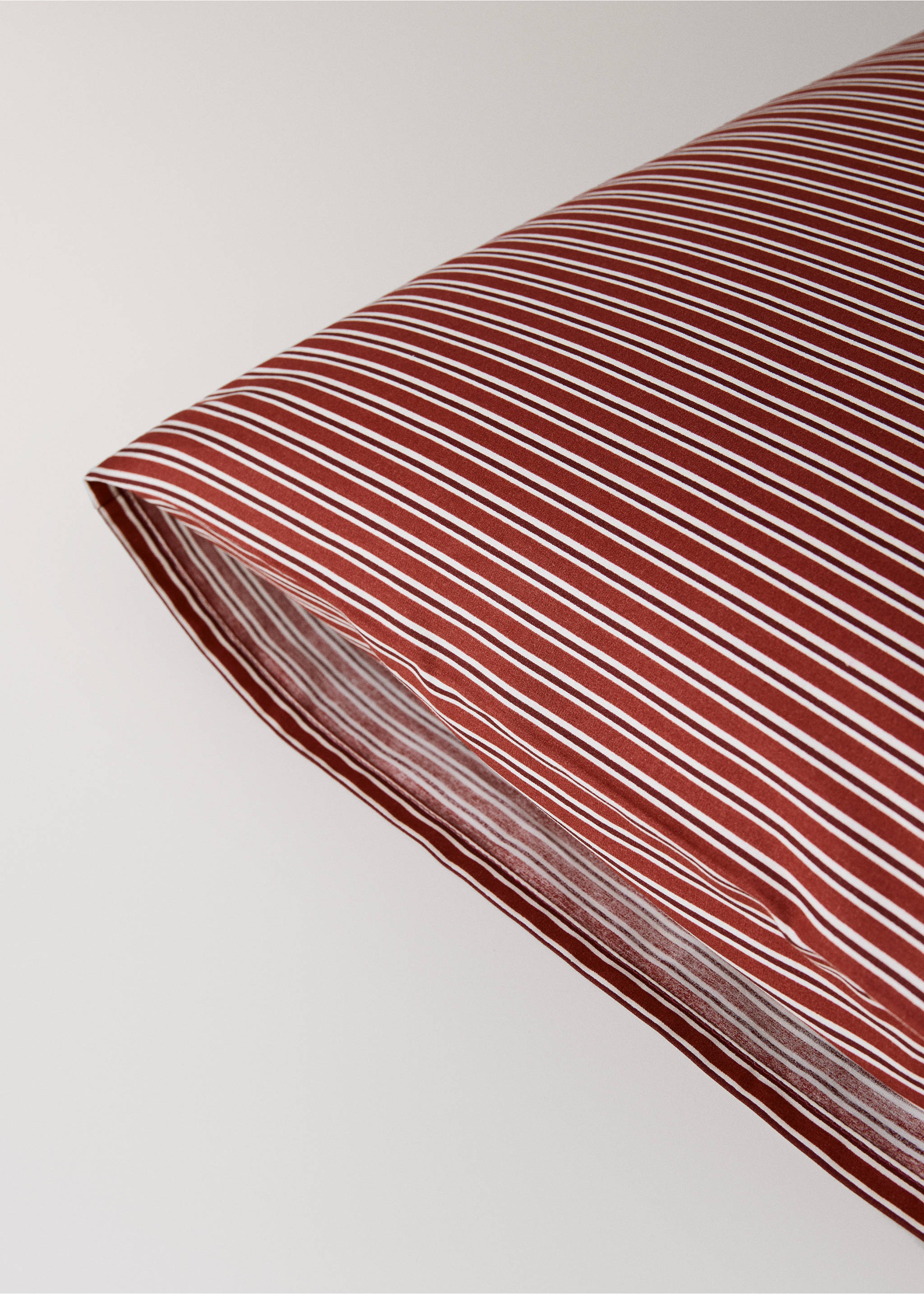 Red and white striped pillowcase in a close-up product detail view, Red. Ref: 37077888-00.