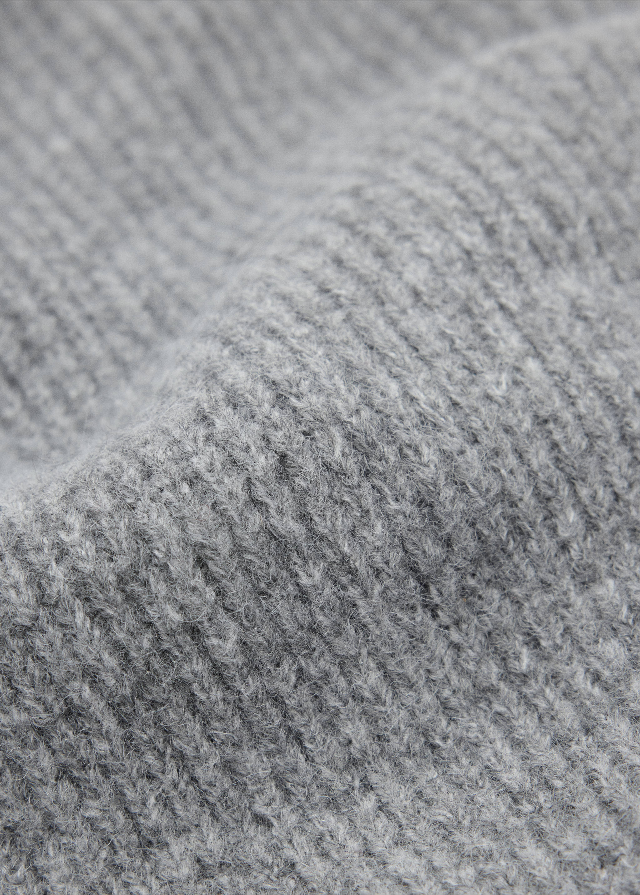 Close-up of a grey ribbed knit beanie showing the textured yarn., Grey. Ref: 37077895-00.