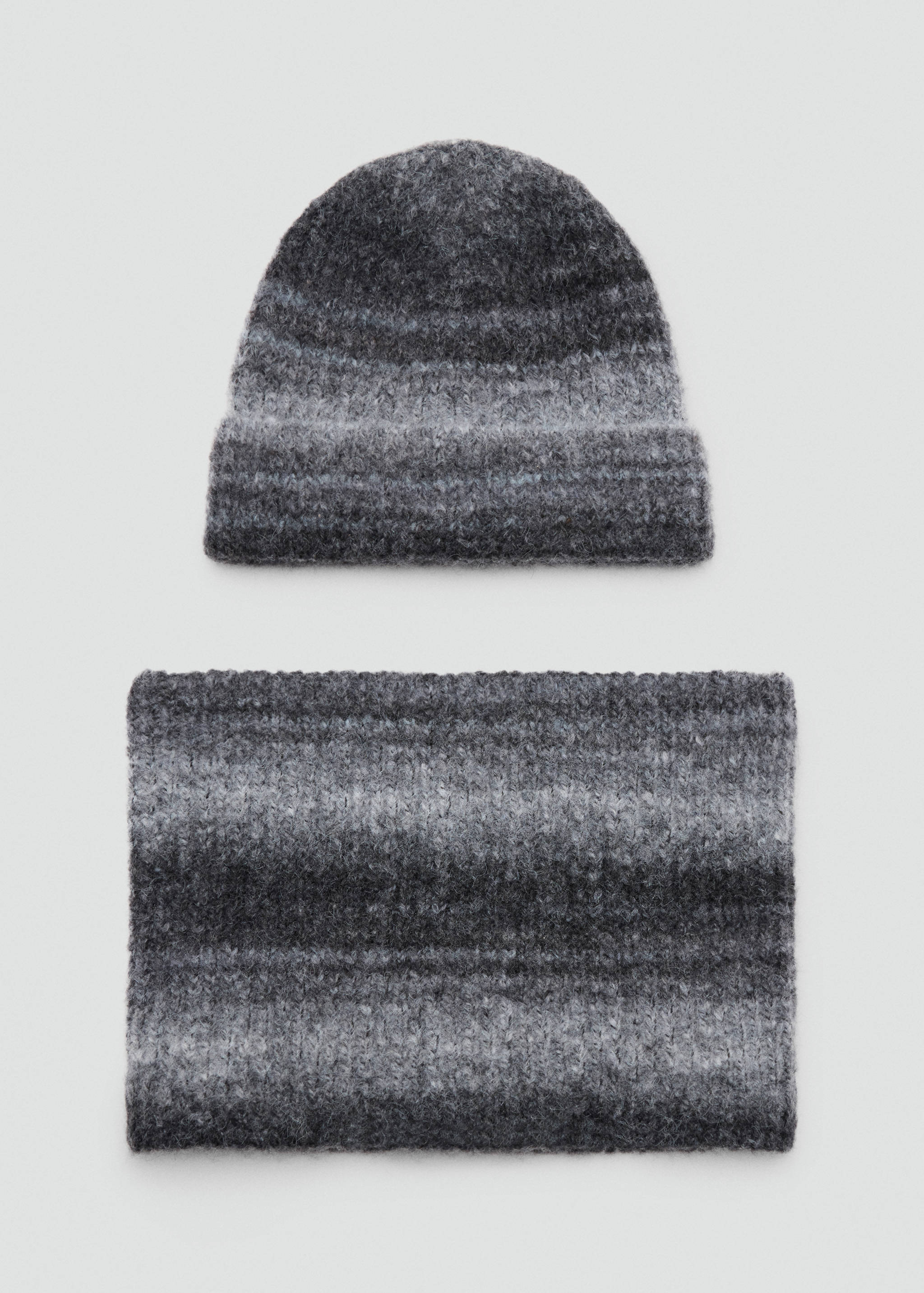 Grey and black melange knitted scarf and beanie set with a textured fuzzy yarn.