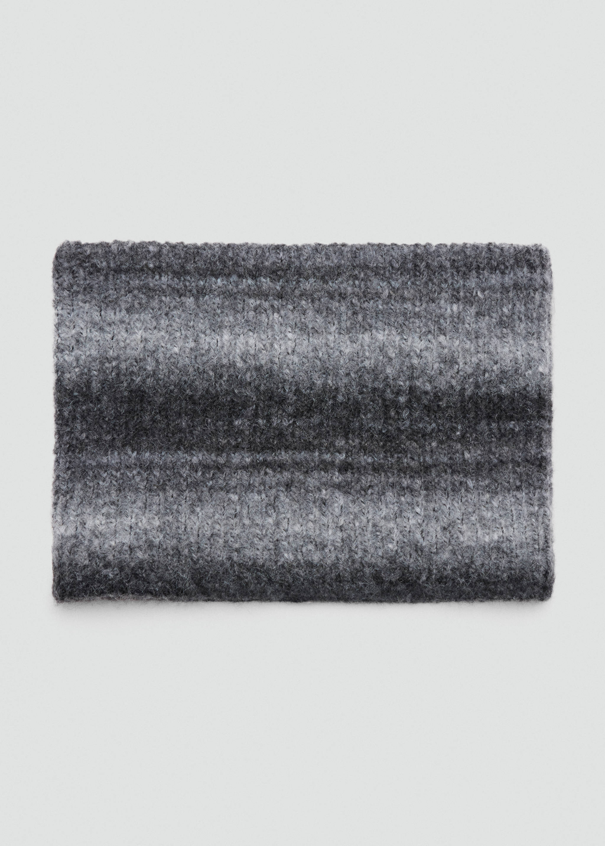 Grey knitted scarf with a fuzzy texture and horizontal stripes.