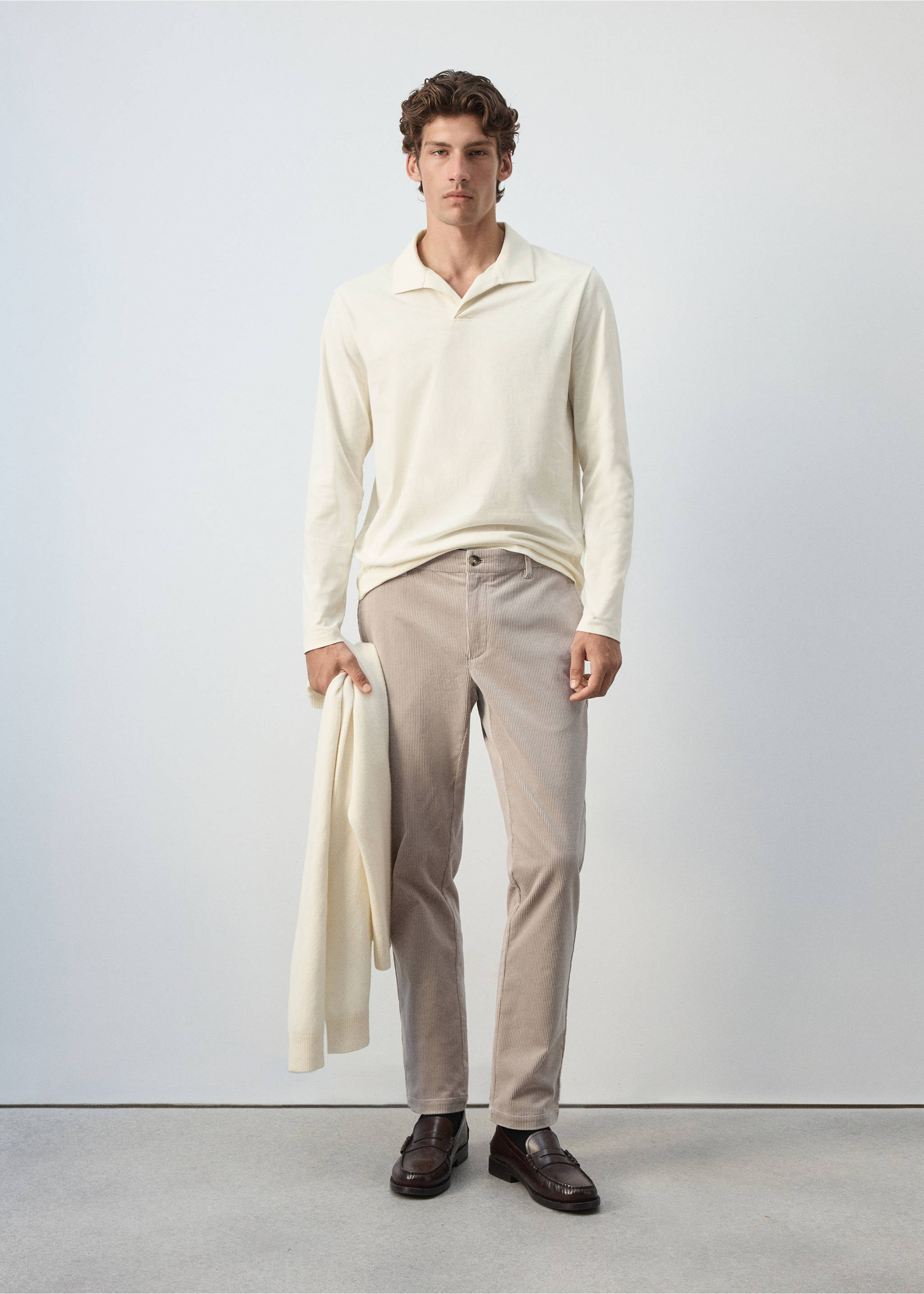 Beige trousers styled with a cream long-sleeved polo shirt., Light/Pastel Grey. Ref: 37077898-00.