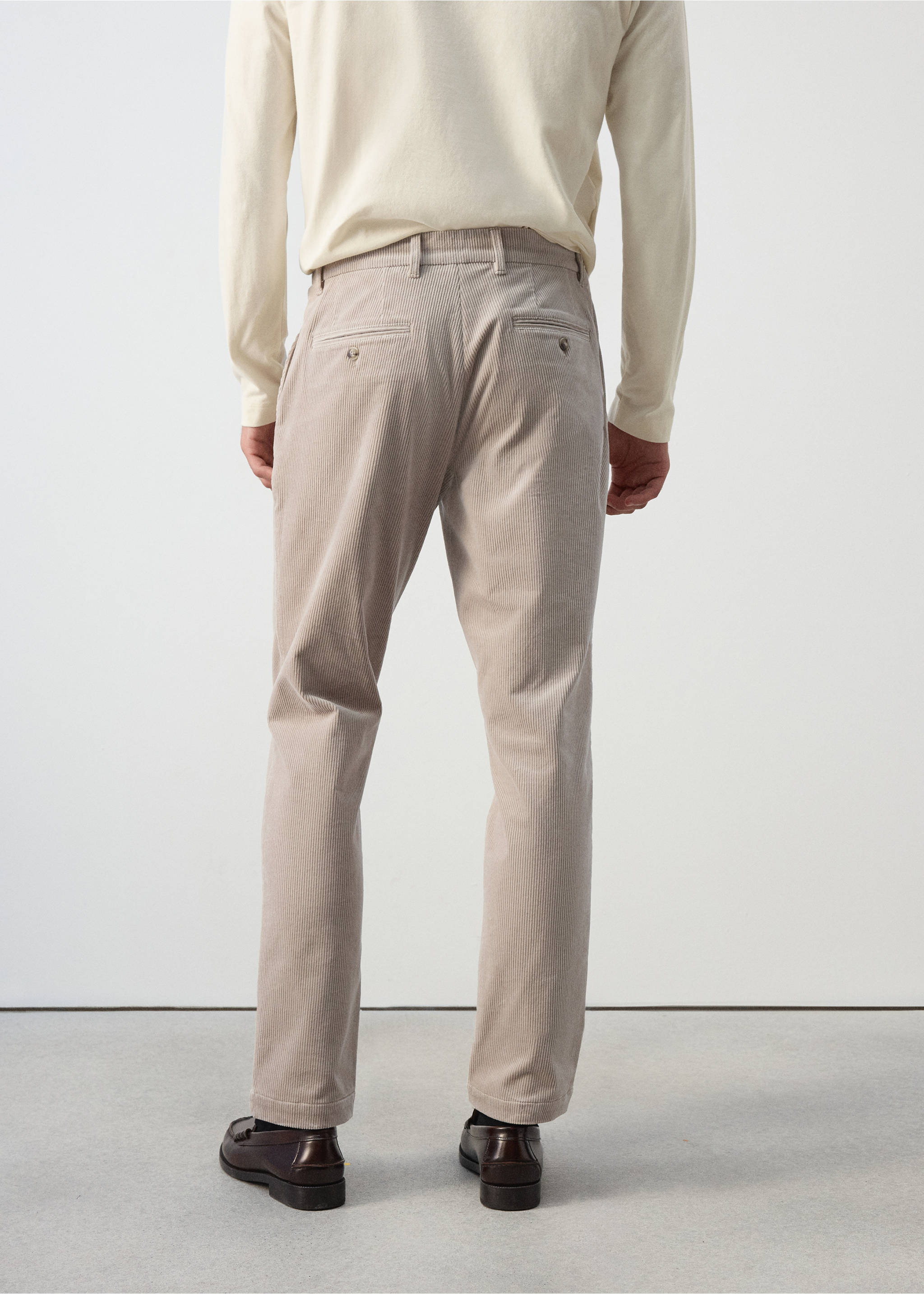 Back view of light beige corduroy trousers with belt loops and buttoned welt pockets., Light/Pastel Grey. Ref: 37077898-00.