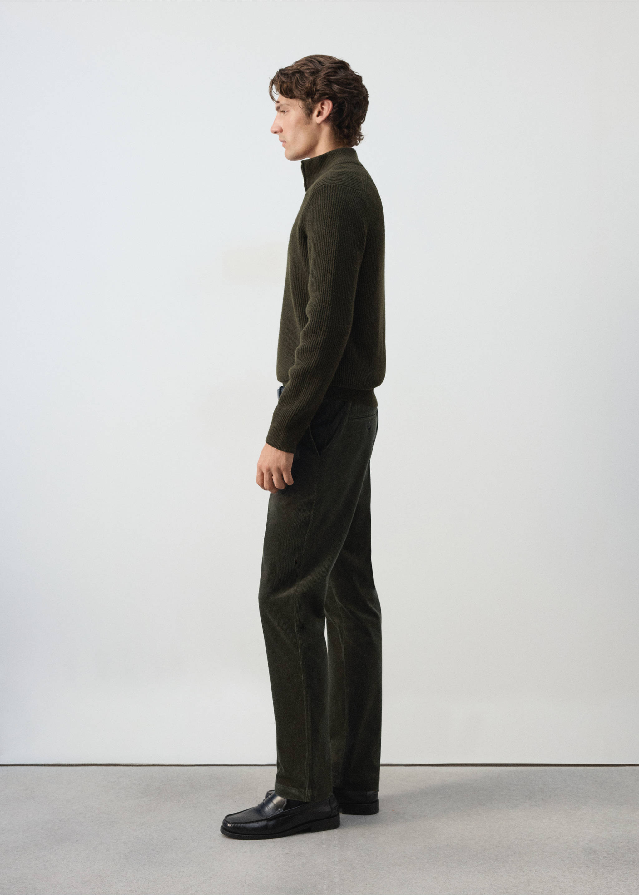 Dark green trousers in a straight-leg fit, shown in profile on a model., Dark Green. Ref: 37077898-00.