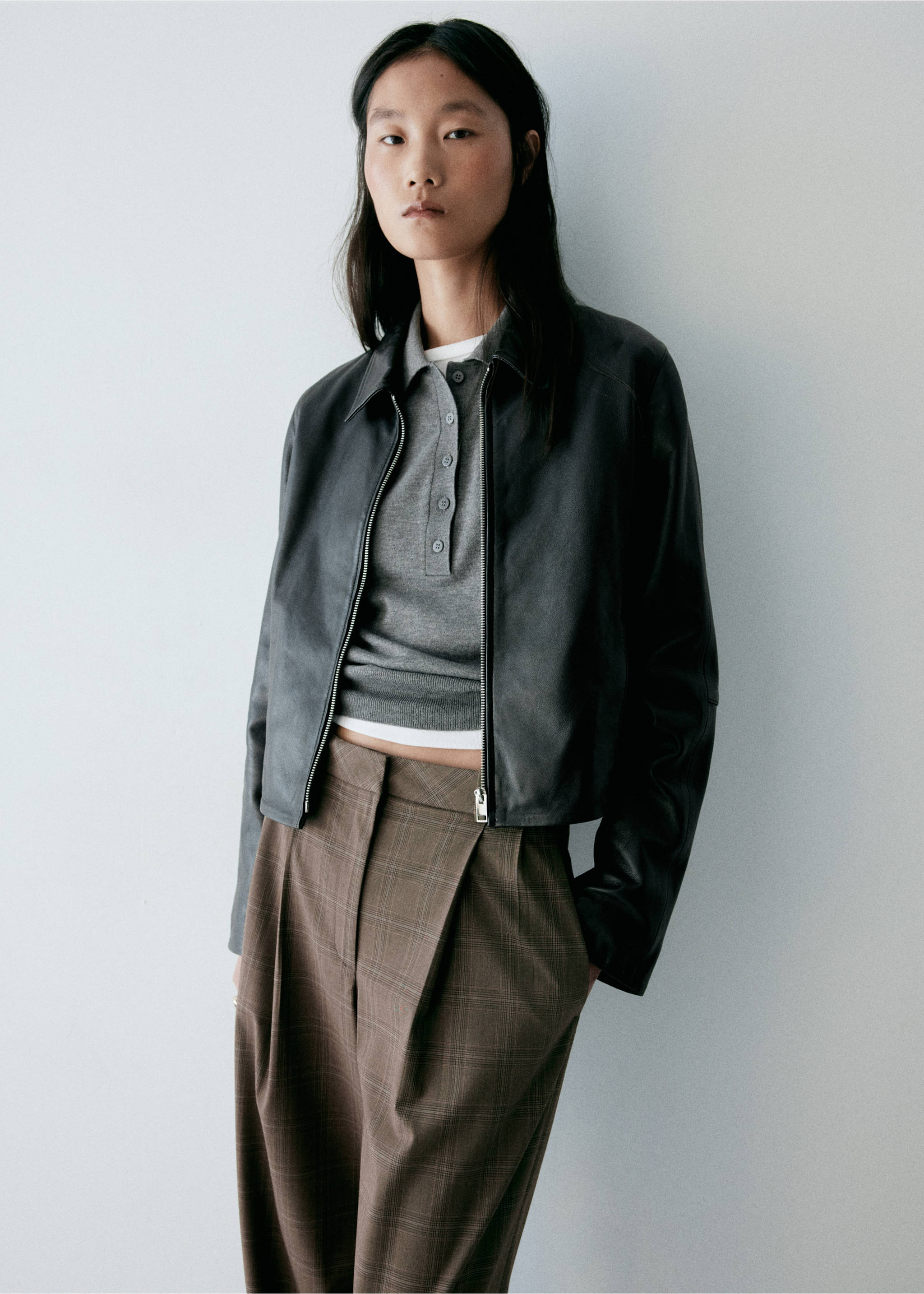 Brown plaid high-waisted trousers with pleats, worn with a grey polo and leather jacket., Brown. Ref: 37077899-00.