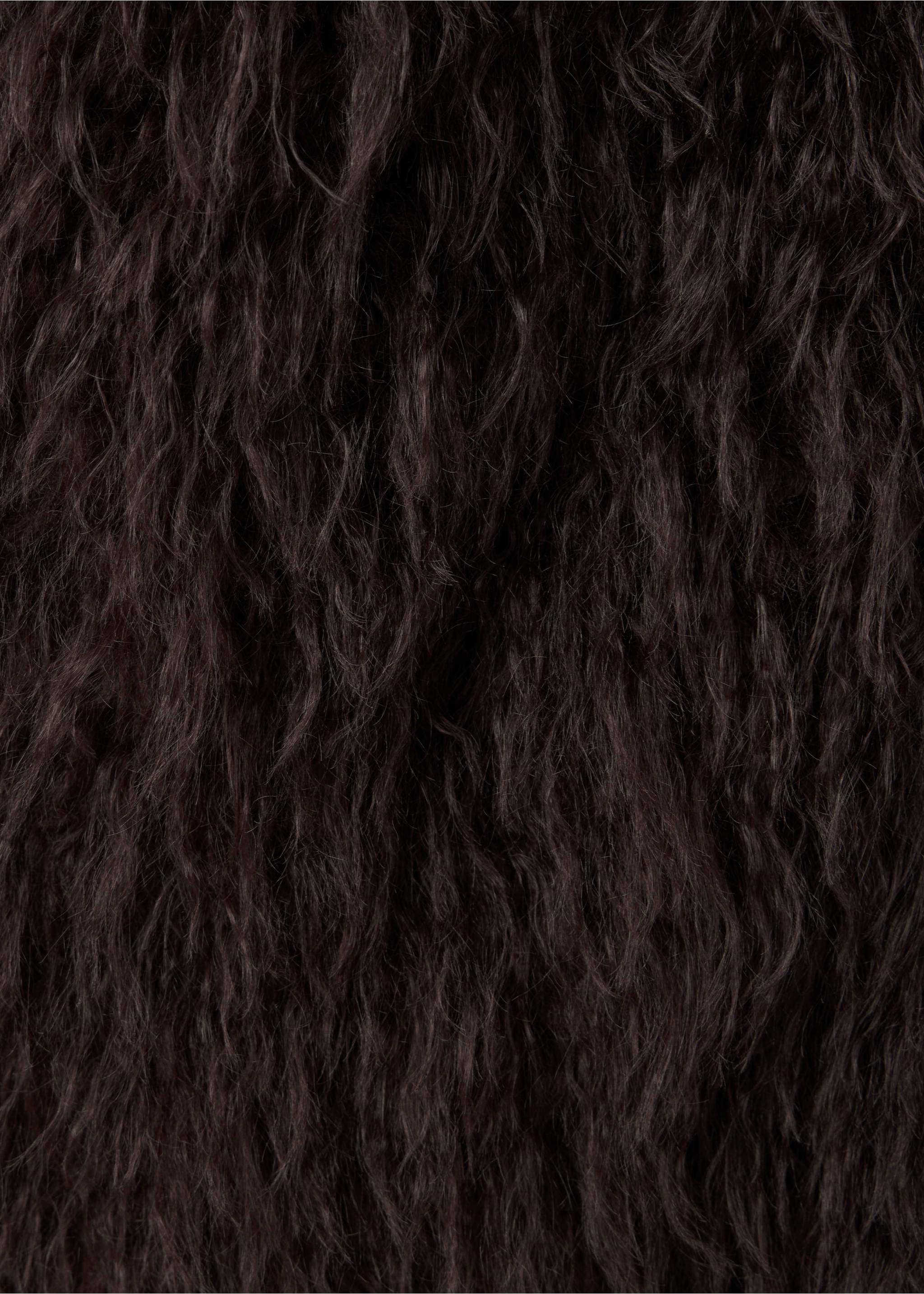 Close-up of dark brown shaggy faux-fur waistcoat fabric., Chocolate. Ref: 37077904-00.