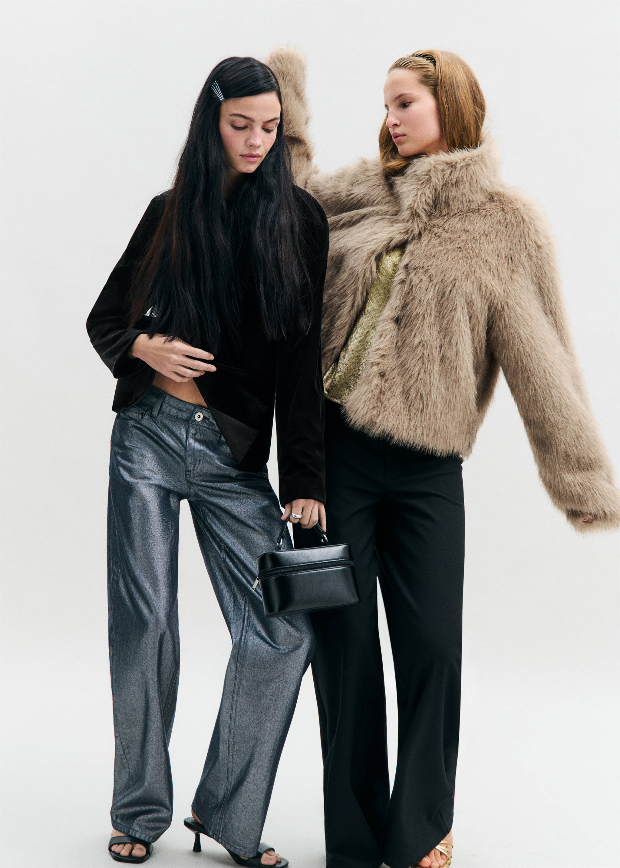 Beige faux-fur coat worn by a model, styled with black trousers alongside another model in metallic trousers., Beige. Ref: 37077905-00.