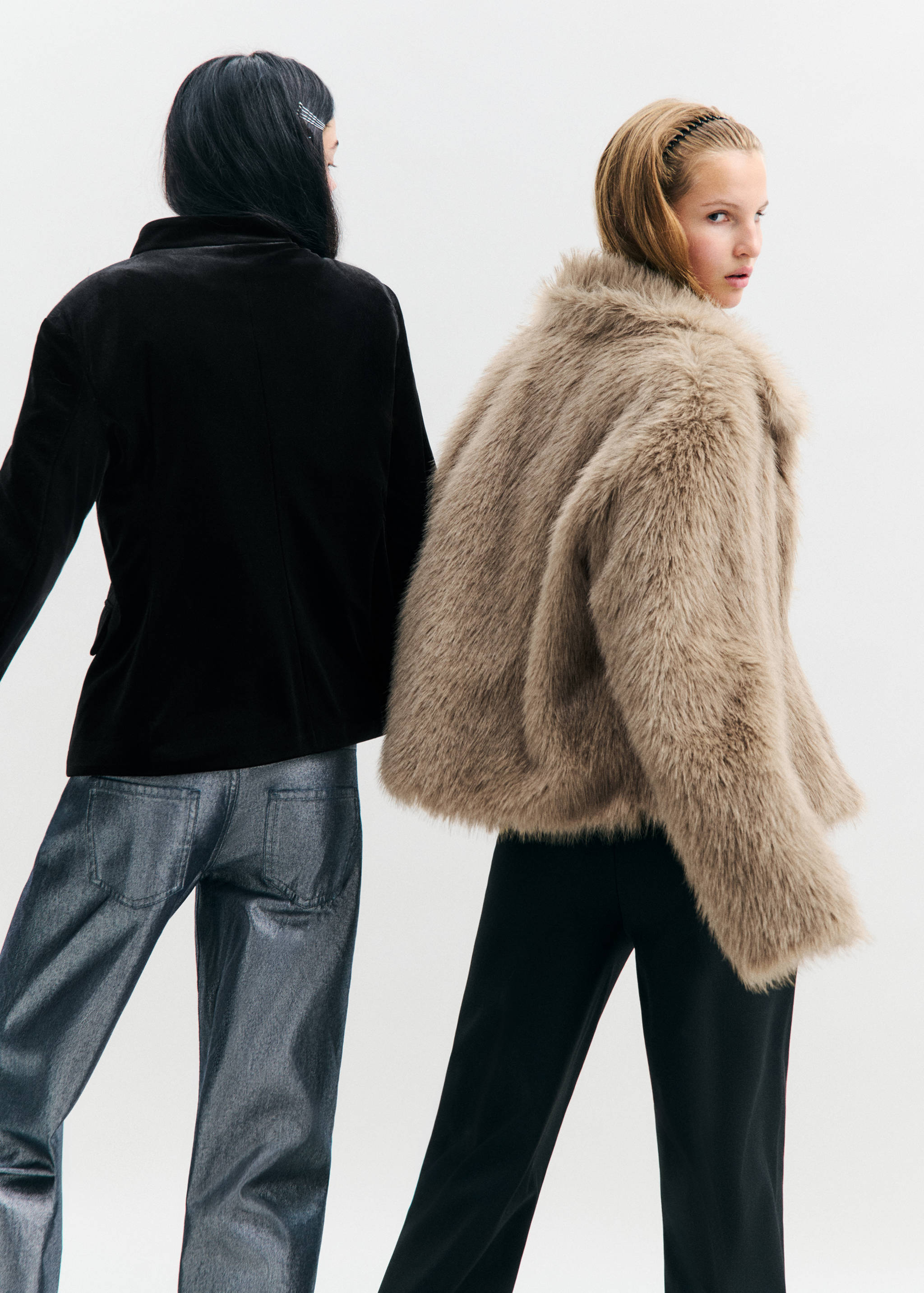 Beige faux-fur coat from the back, worn by a model