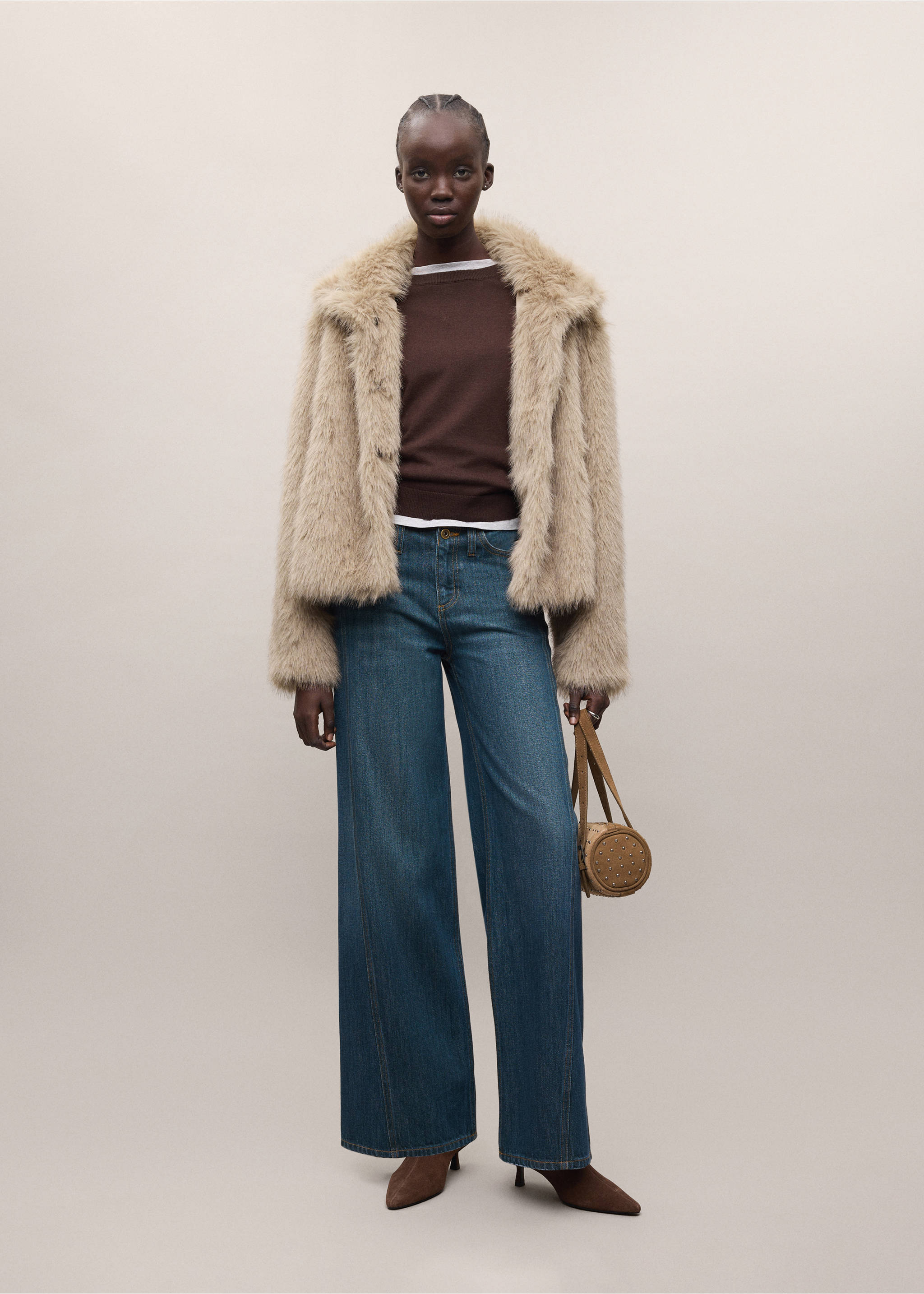 Beige faux-fur coat worn with a brown jumper and blue wide-leg jeans., Beige. Ref: 37077905-01.