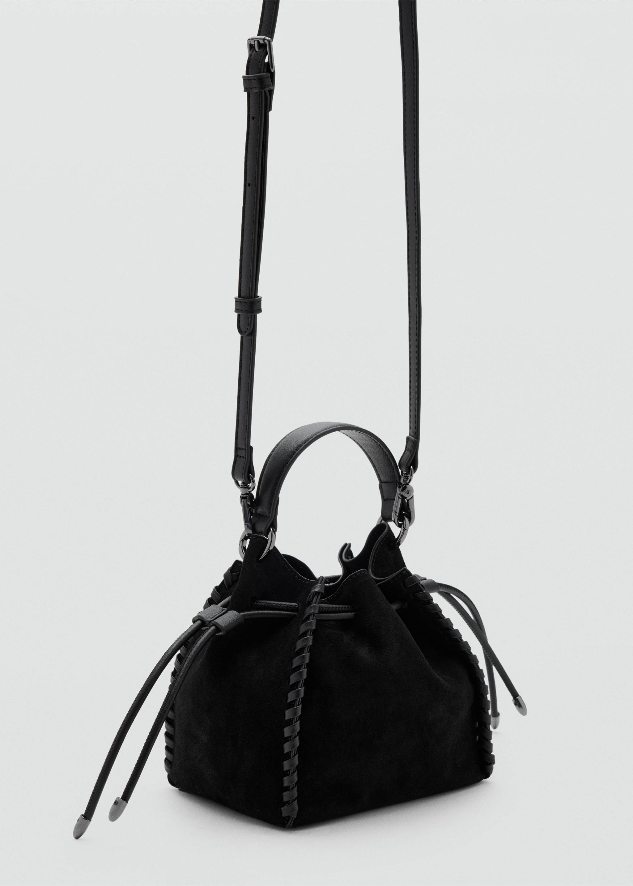 Black suede mini handbag with drawstring closure, whipstitch trim, top handle and long shoulder strap., Black. Ref: 37077927-00.
