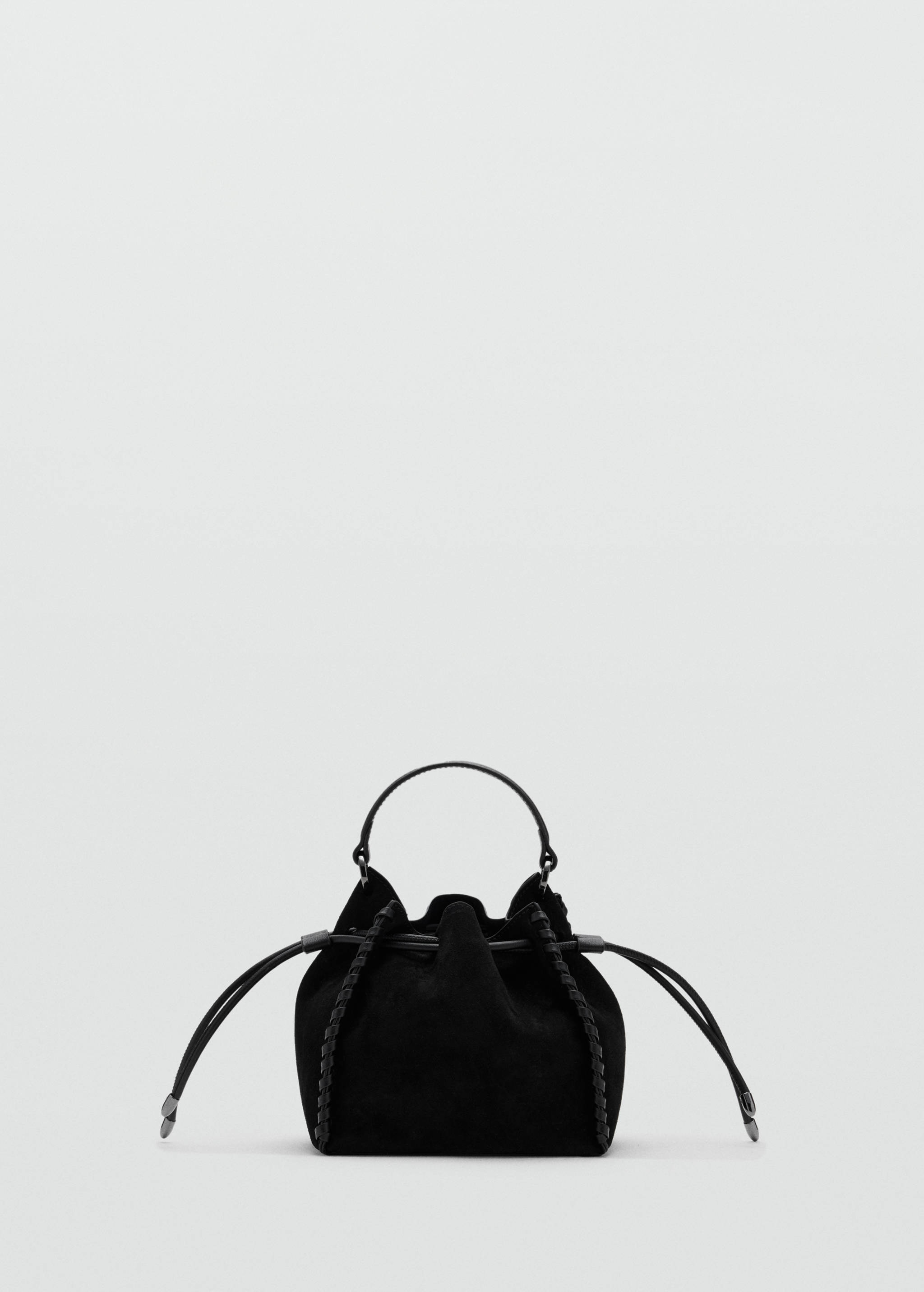 Black mini bag with a drawstring closure, top handle, and braided side trim.