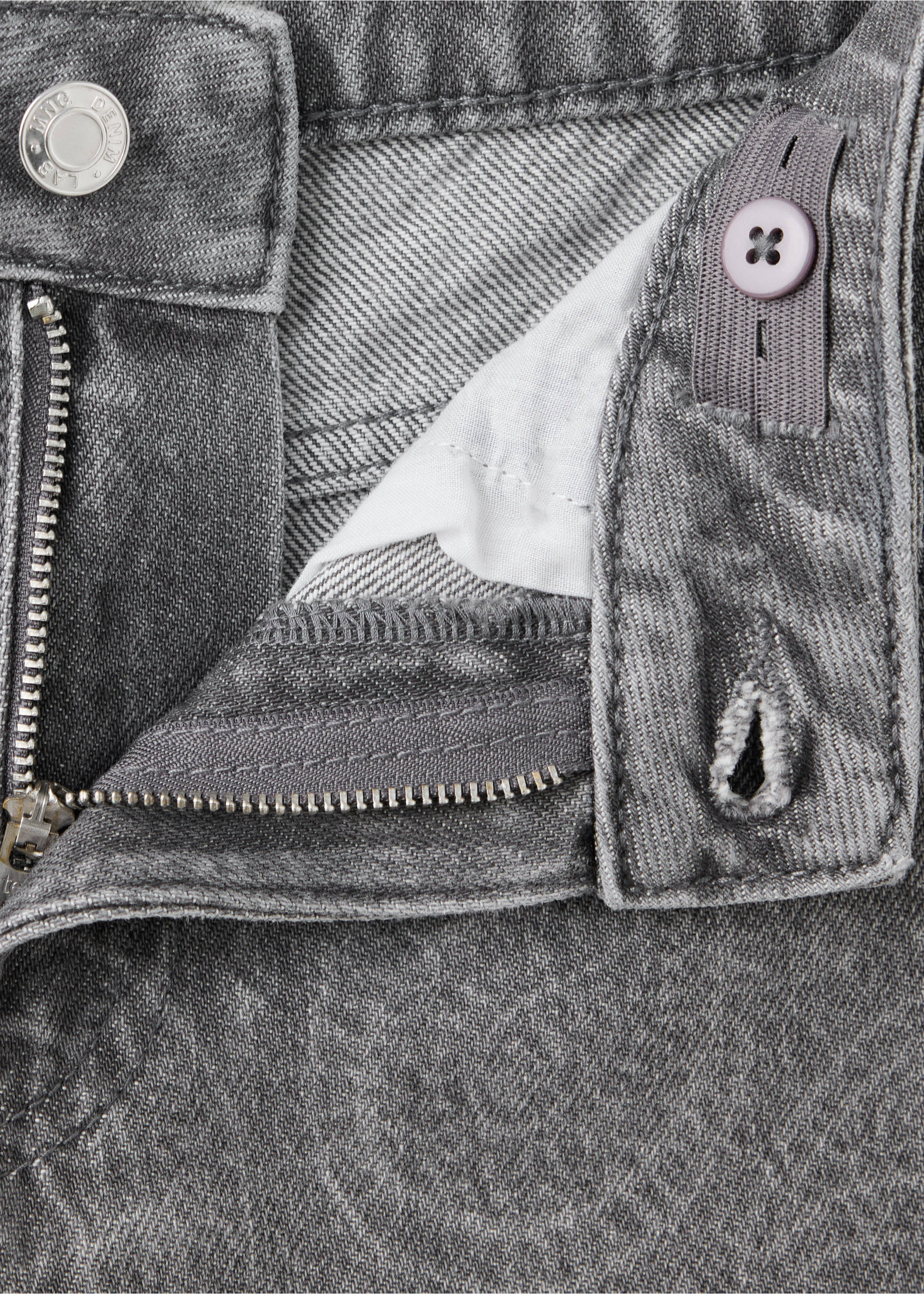 Close-up of grey denim trousers showing the waistband, zip fly, and button detail., Denim Grey. Ref: 37077932-00.