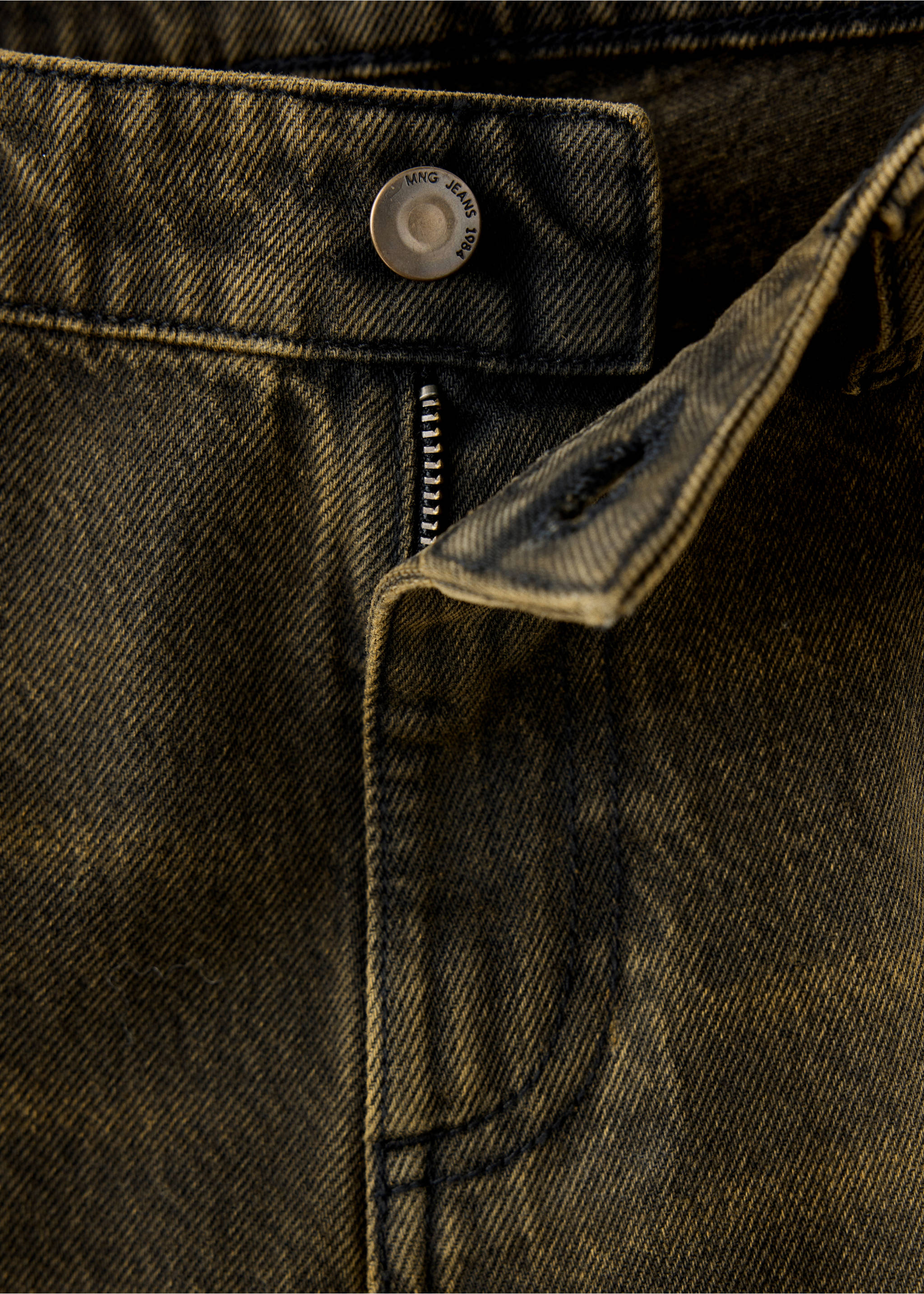 Close-up of the waistband and button fly of vintage-wash dark denim trousers., Dark Vintage Blue. Ref: 37077939-00.