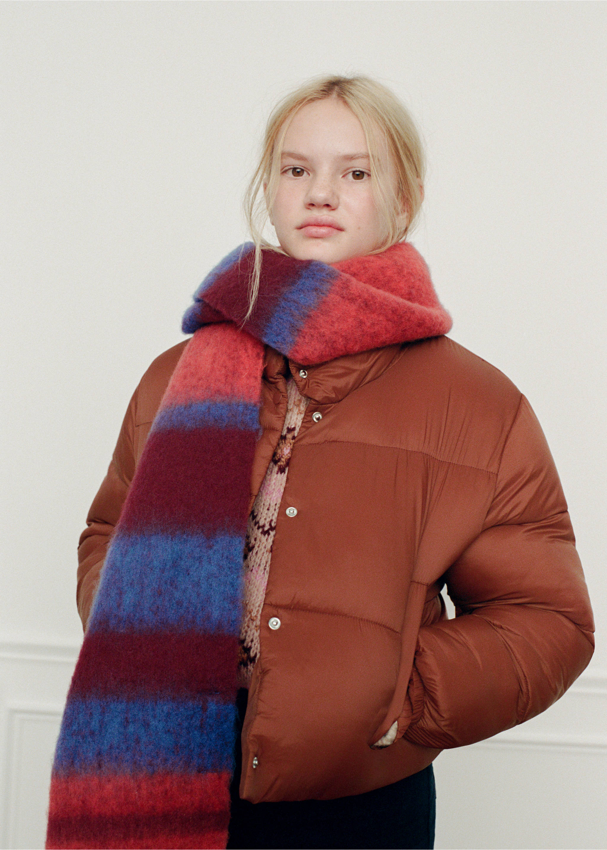 Red, blue and purple striped soft scarf worn with a brown puffer jacket., Russet. Ref: 37078264-00.