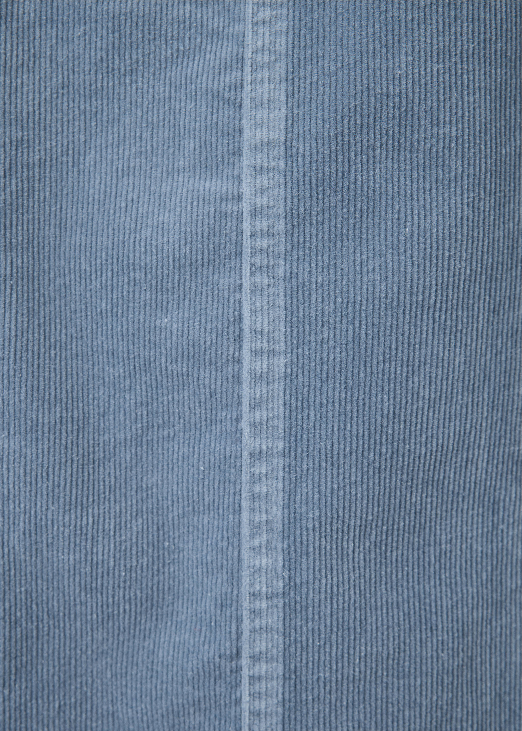Close-up of blue corduroy fabric with a vertical seam., Blue. Ref: 37078270-00.