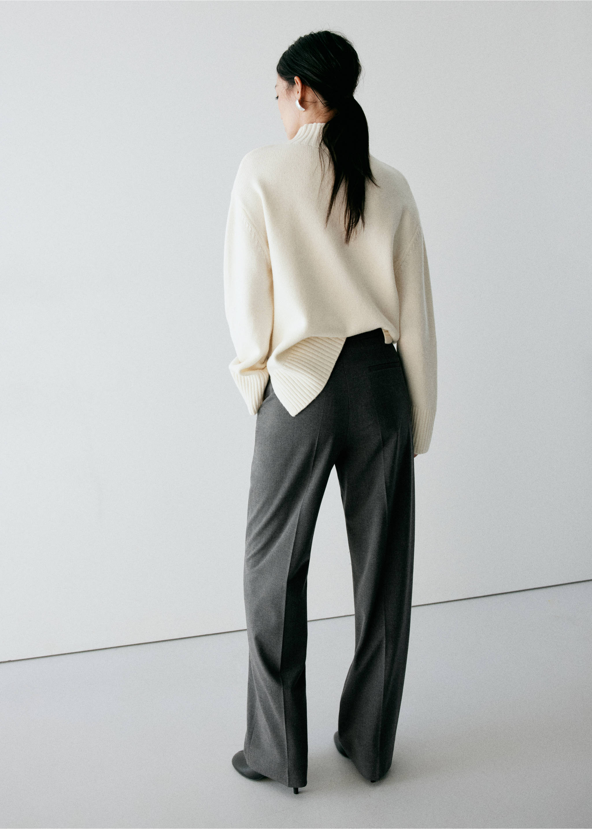 Back view of dark grey trousers, styled with a cream high-neck jumper., Grey. Ref: 37078273-00.