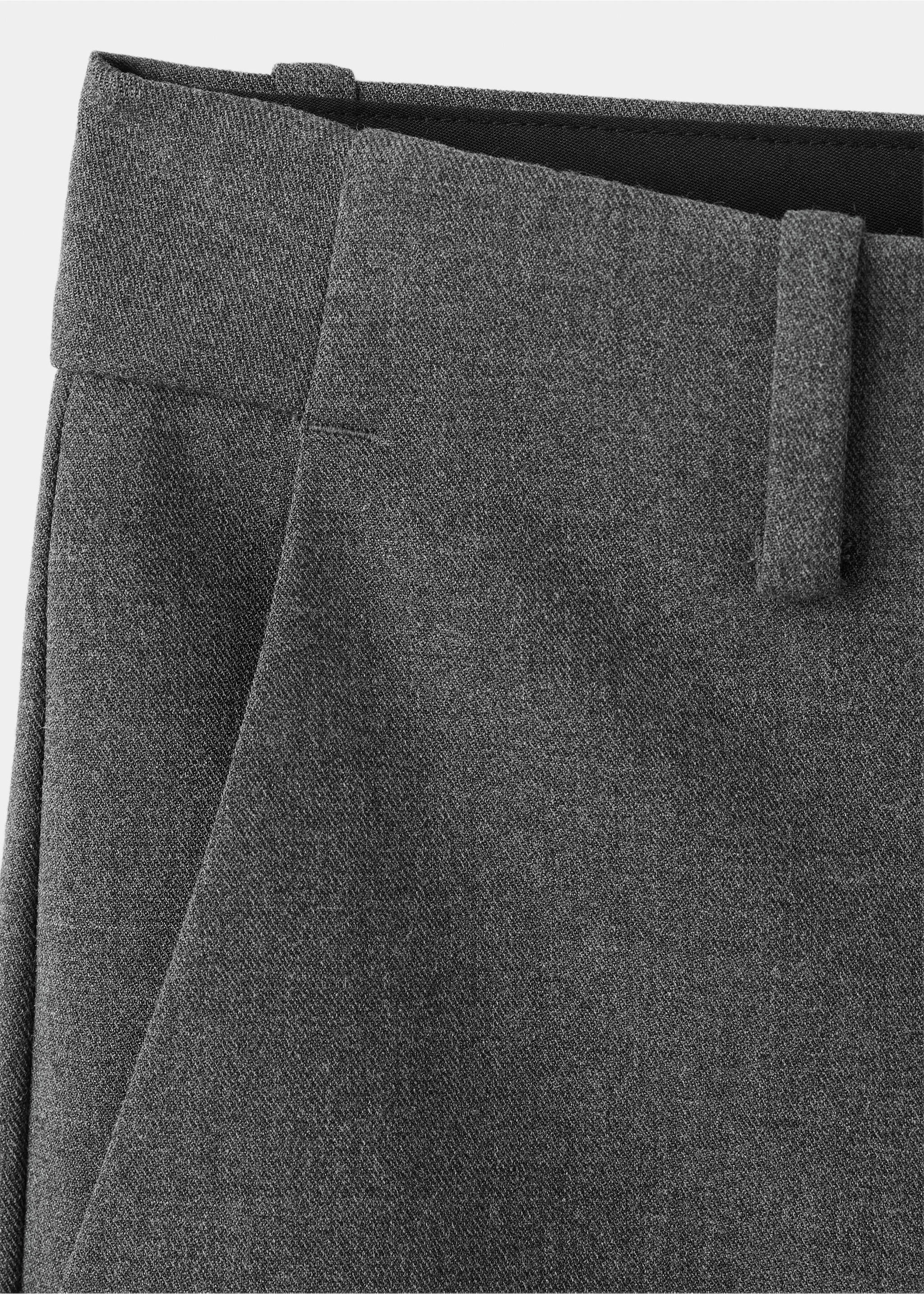 Close-up of dark grey trousers showing the waistband, belt loops, and pocket., Grey. Ref: 37078273-00.