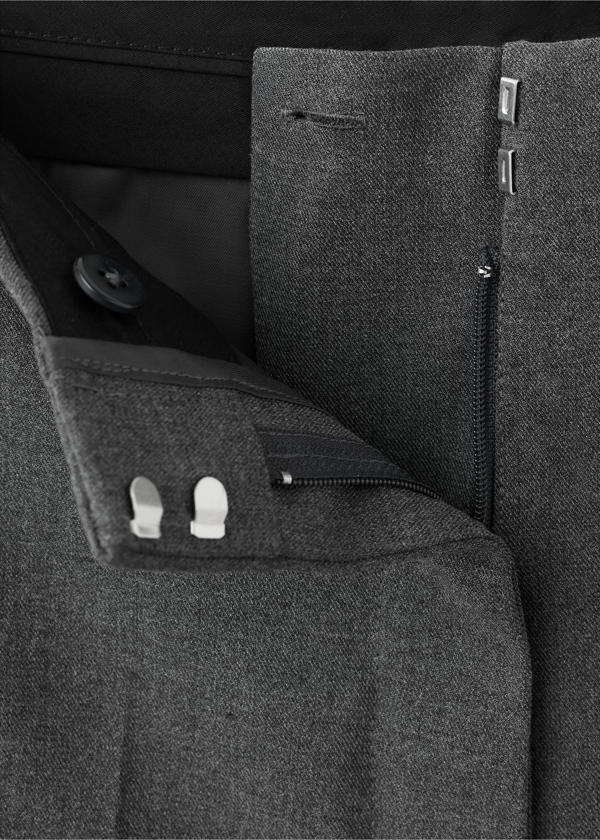 Close-up of dark grey trousers focusing on the waistband and fastening details., Grey. Ref: 37078273-00.